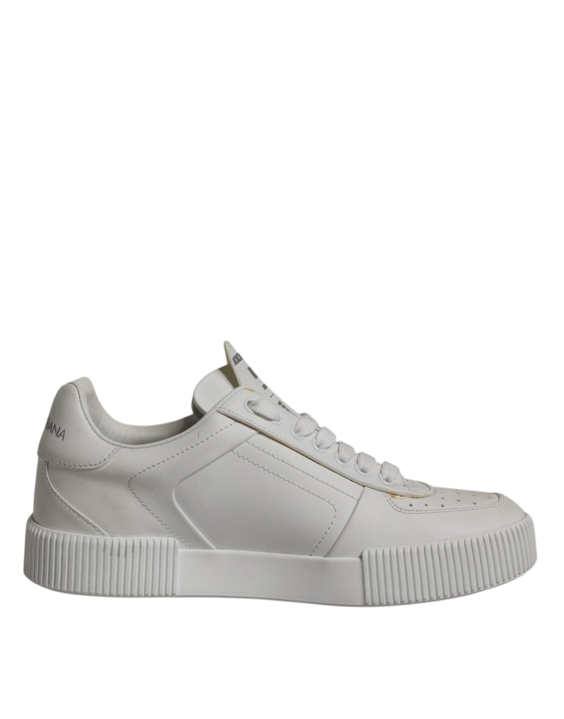 A pair of white leather sneakers with a low top, featuring a chunky sole and a logo on the side