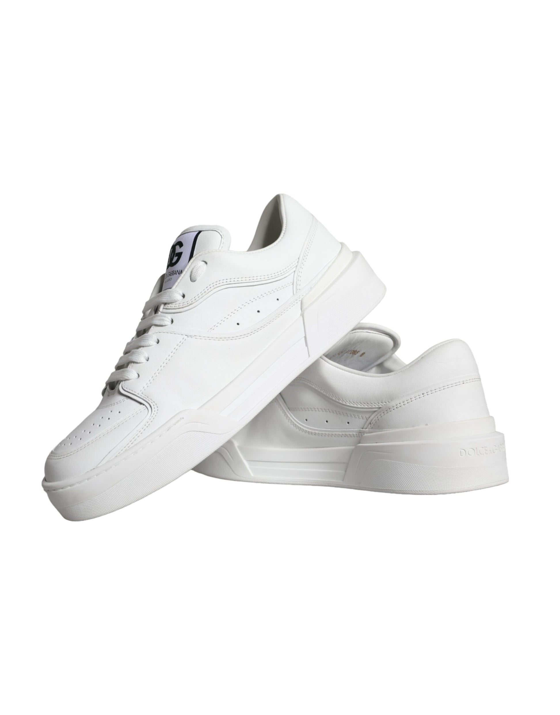 Pair of white leather sneakers with low top and laces, featuring a logo on the side
