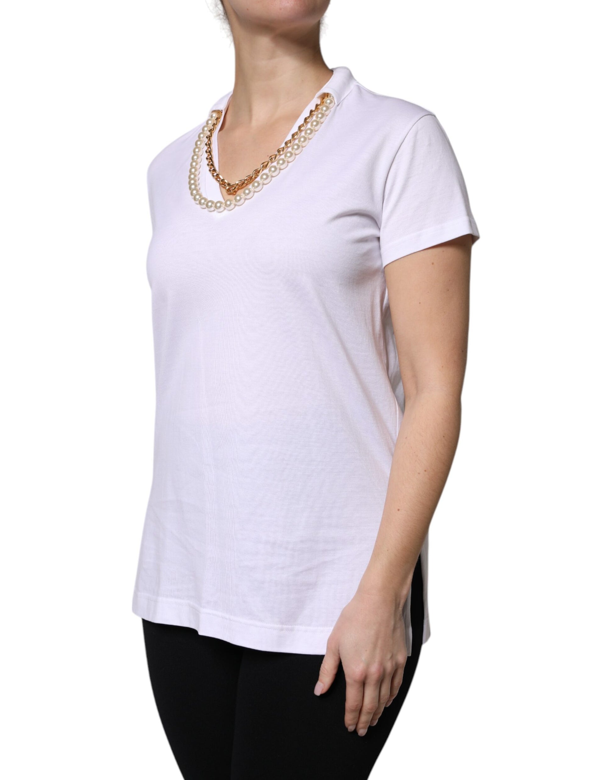 Woman wearing white shirt and necklace