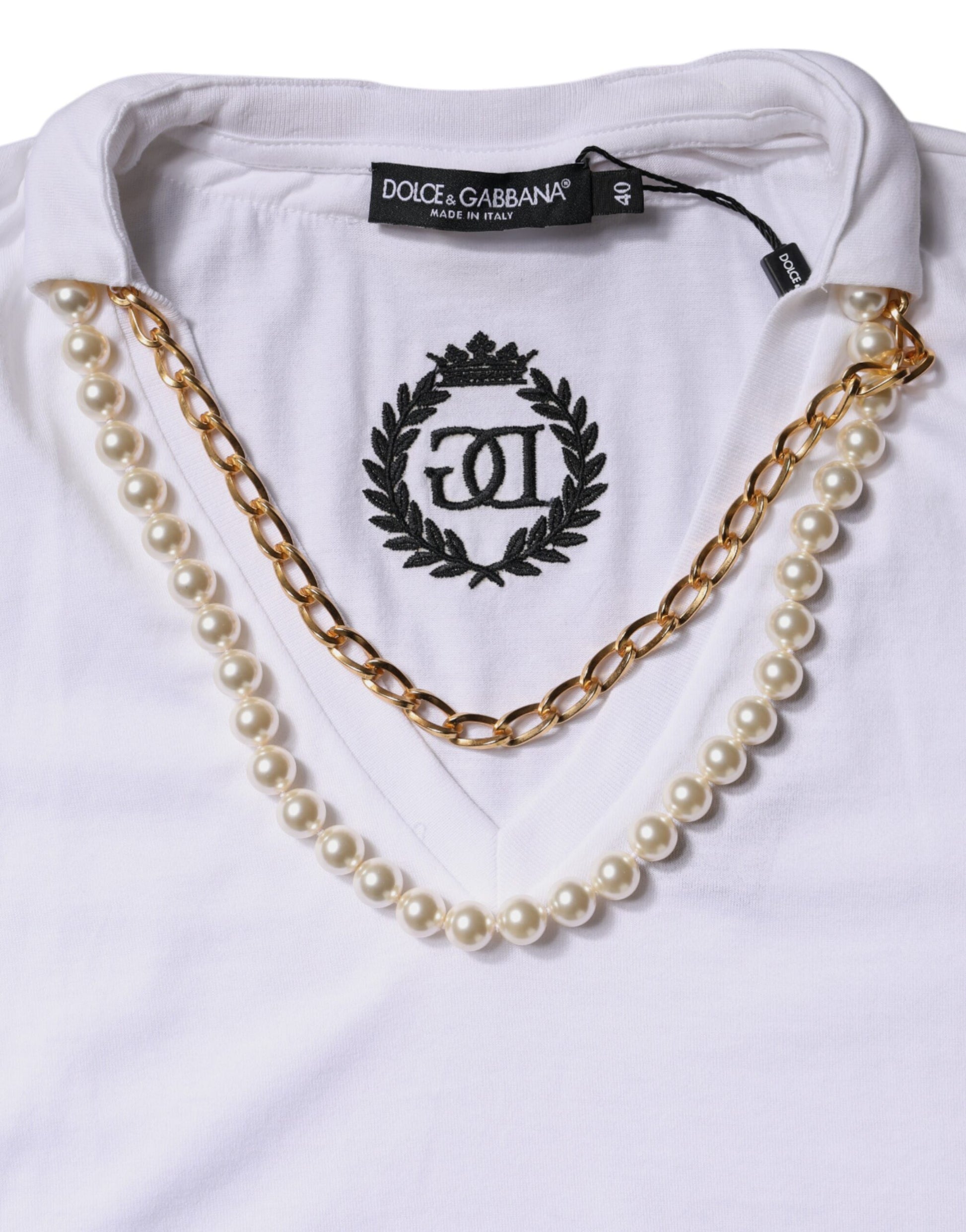 White shirt with pearl necklace around neck
