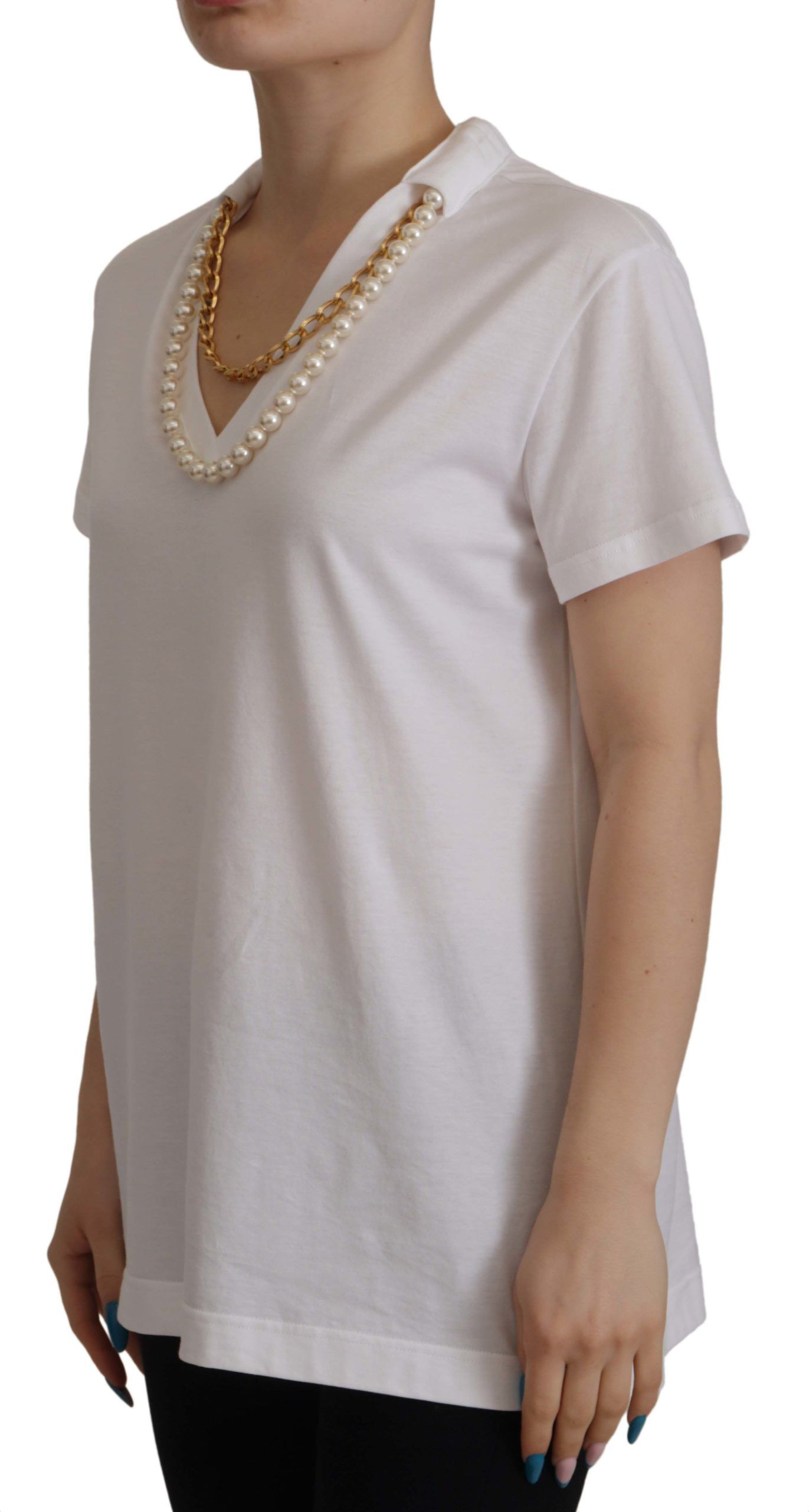 Woman wearing white shirt and pearl necklace