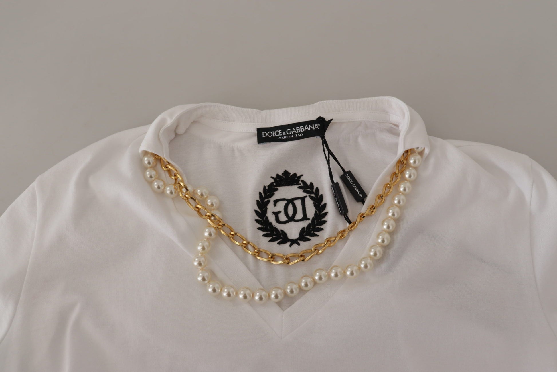White shirt with pearl necklace