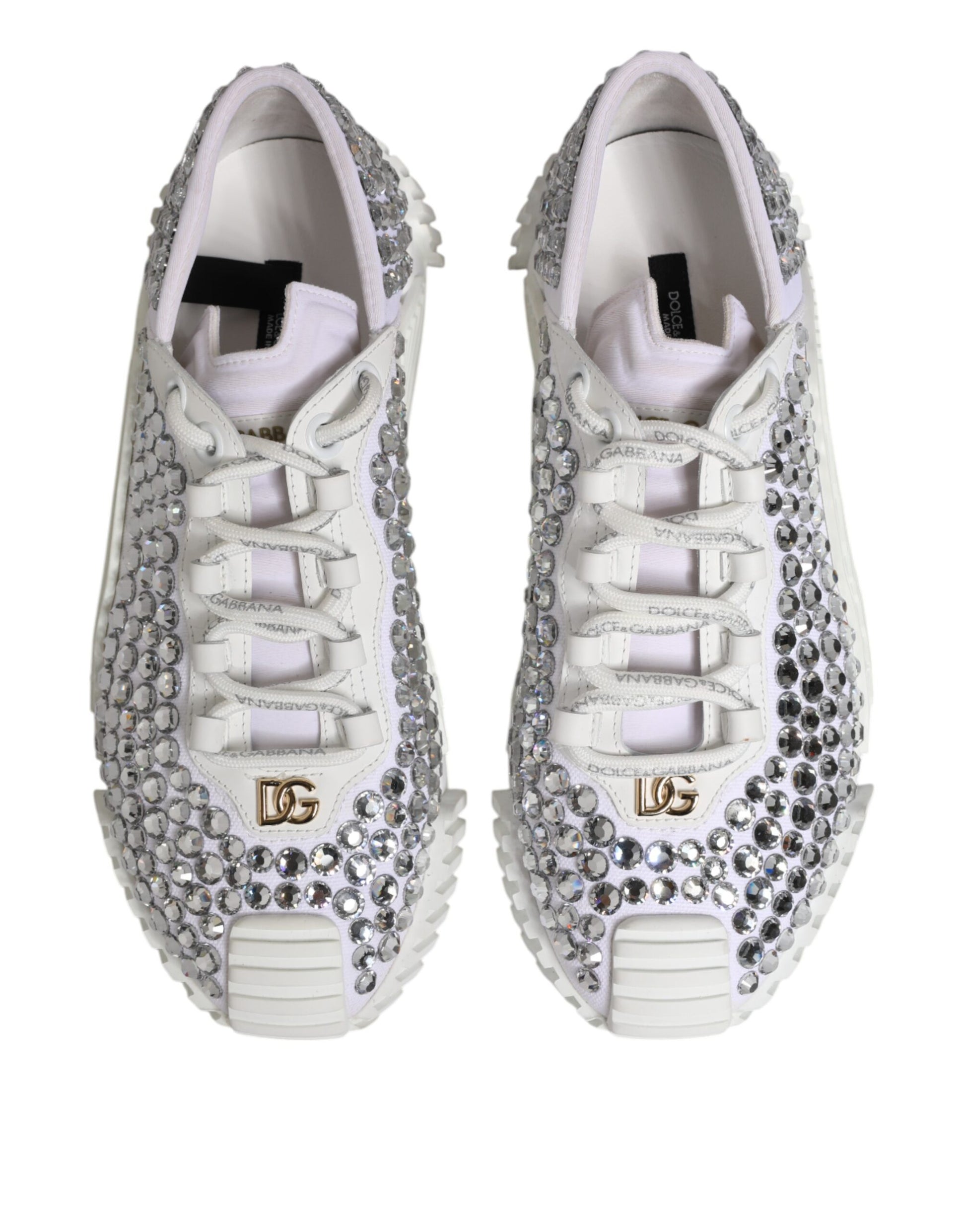 Pair of white sneakers with embellishments and gold accents