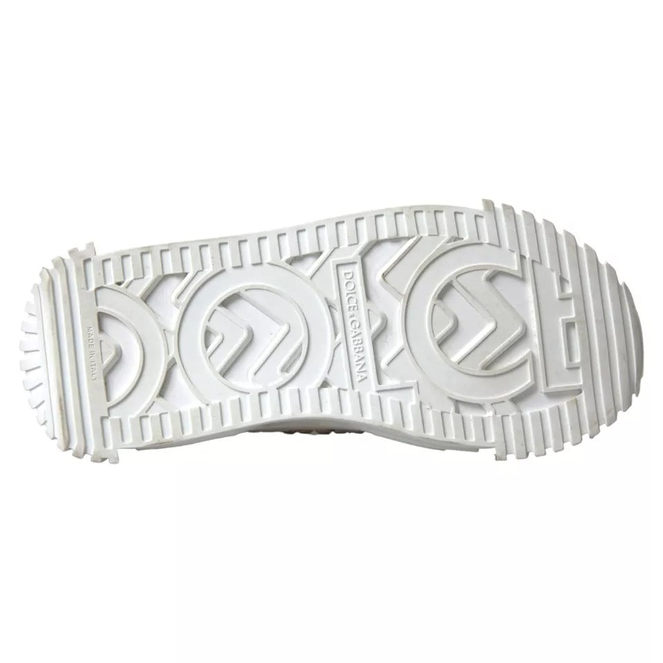 A pair of white canvas leather sneakers with embellishments, featuring the Dolce & Gabbana logo