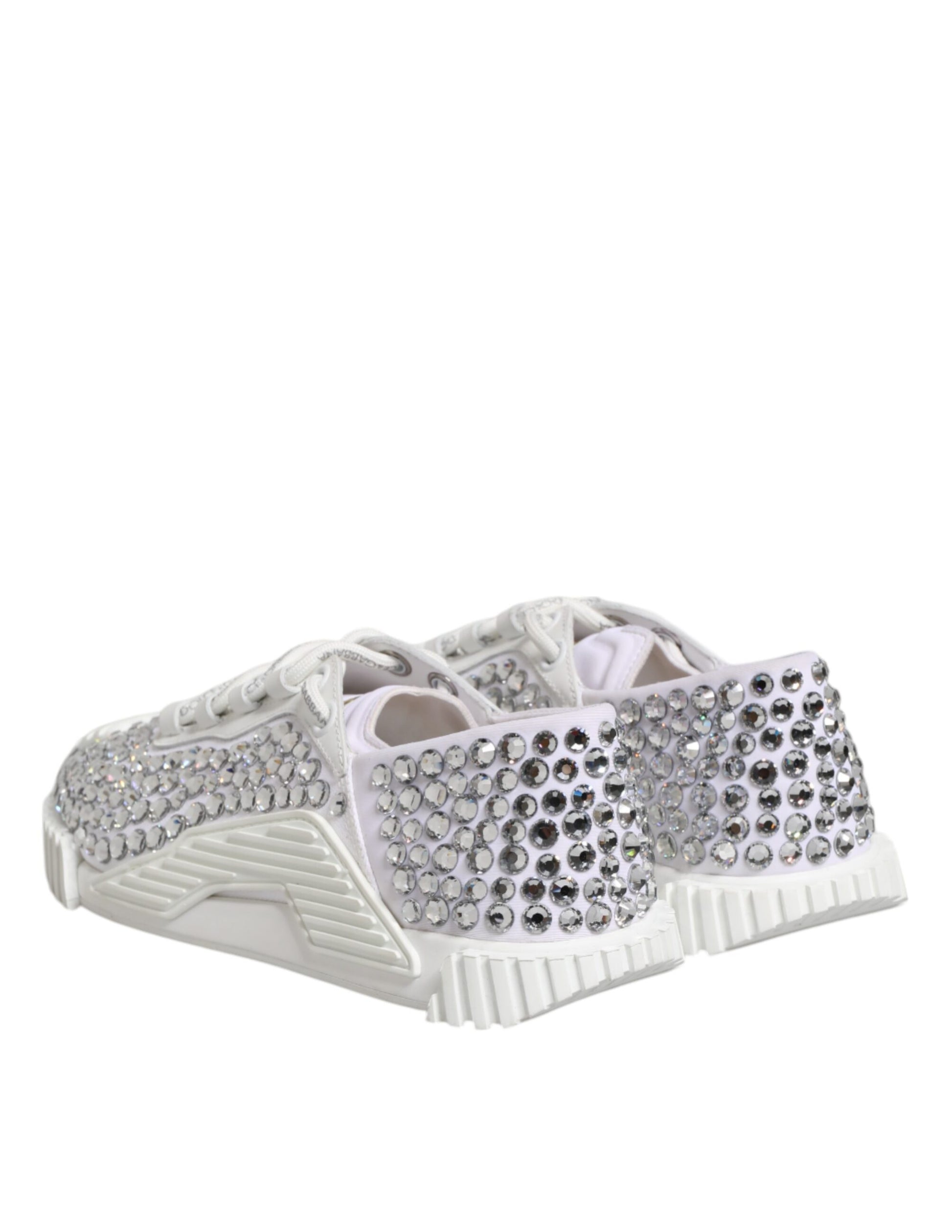 Pair of white embellished sneakers with pink laces and silver studs