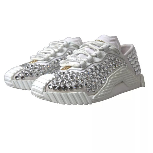 White sneakers with embellishments, featuring a canvas and leather design