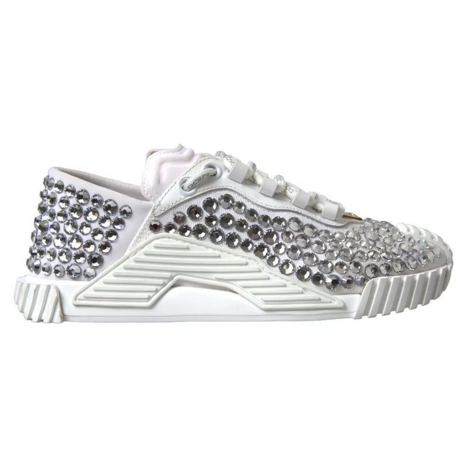 White embellished sneakers with silver studs and a leather upper