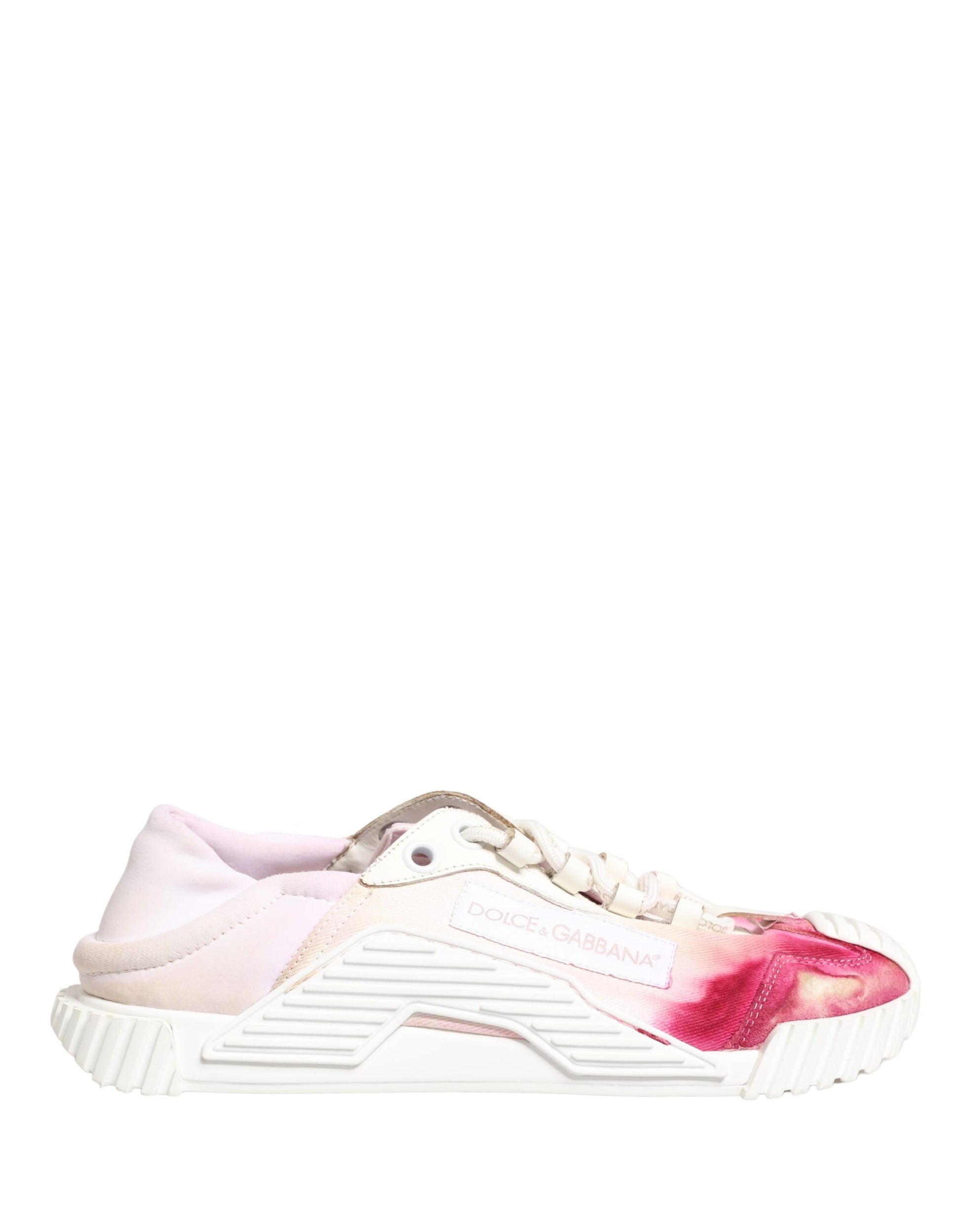 Pink and white lace-up sneakers with a red stain on the side