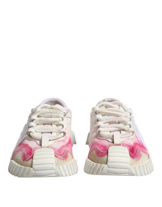 Pair of white lace-up sneakers with pink and purple splatter design