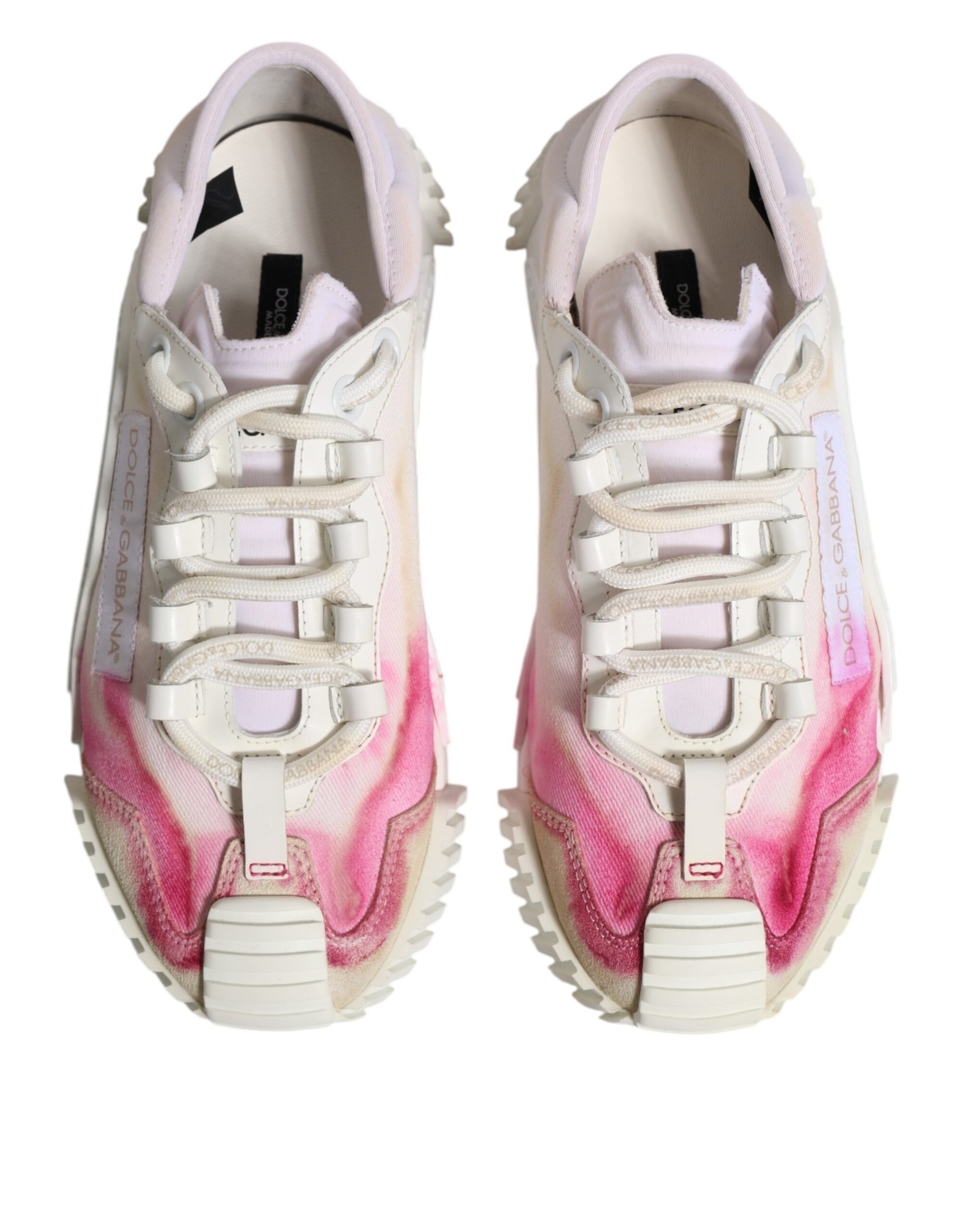Pair of white lace-up sneakers with pink and purple splatter design