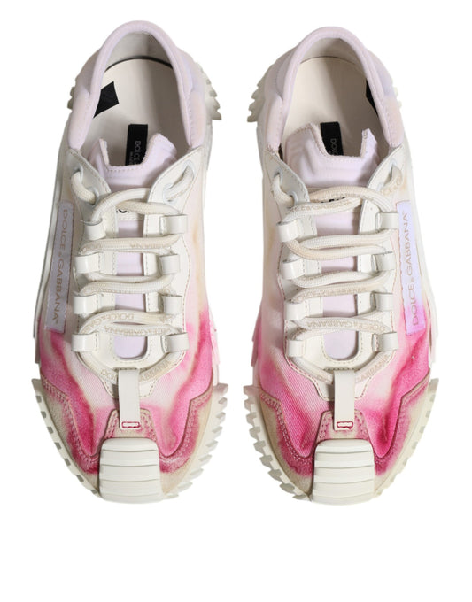 Pair of white lace-up sneakers with pink and purple splatter design