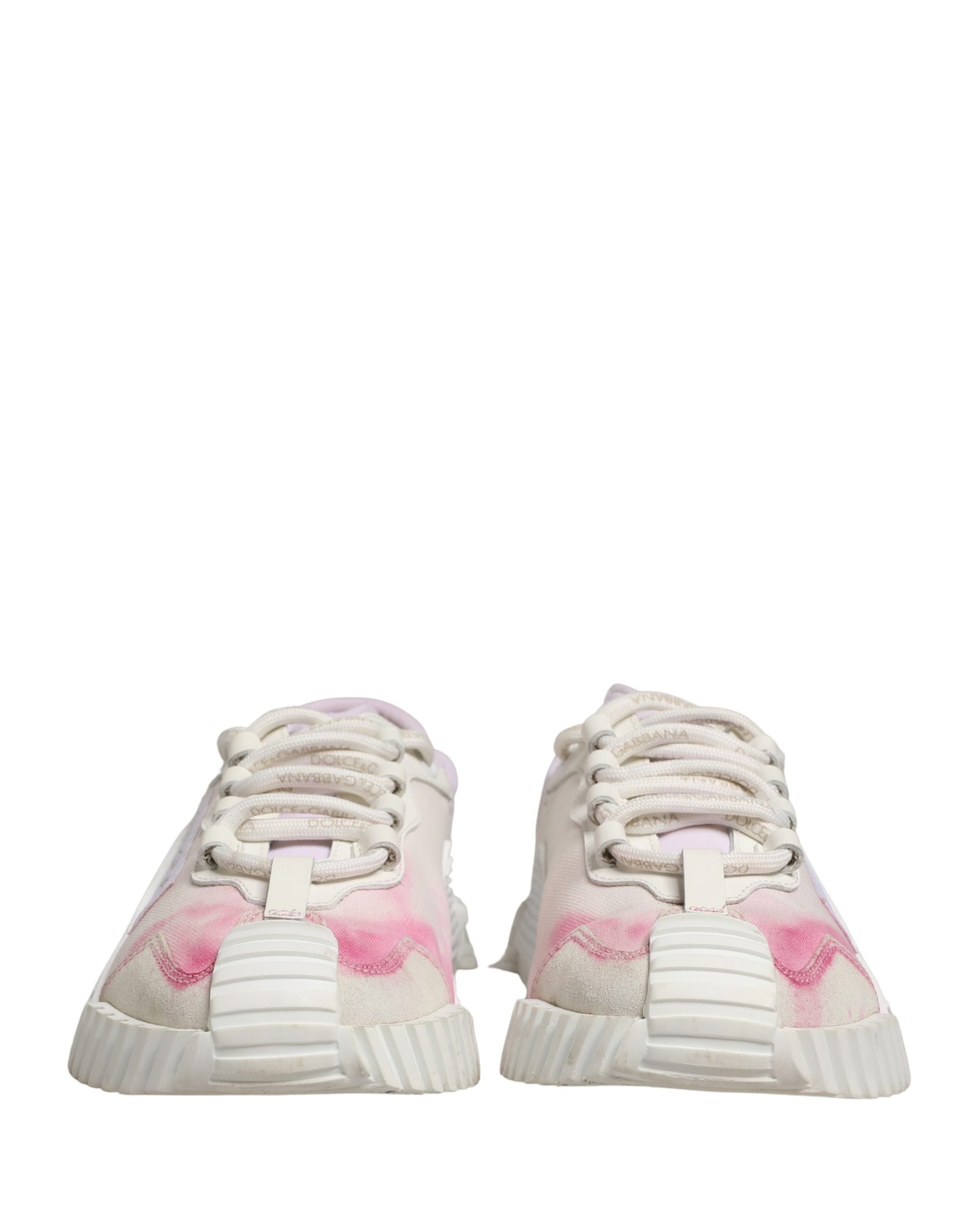 Pink and white lace-up sneakers with a textured sole