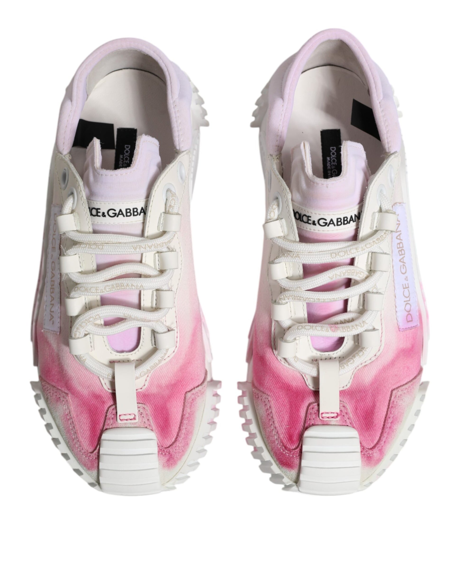 Pair of white lace-up sneakers with pink and purple splatter design