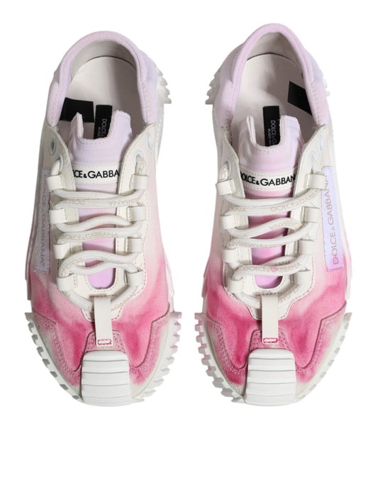 Pair of white lace-up sneakers with pink and purple splatter design