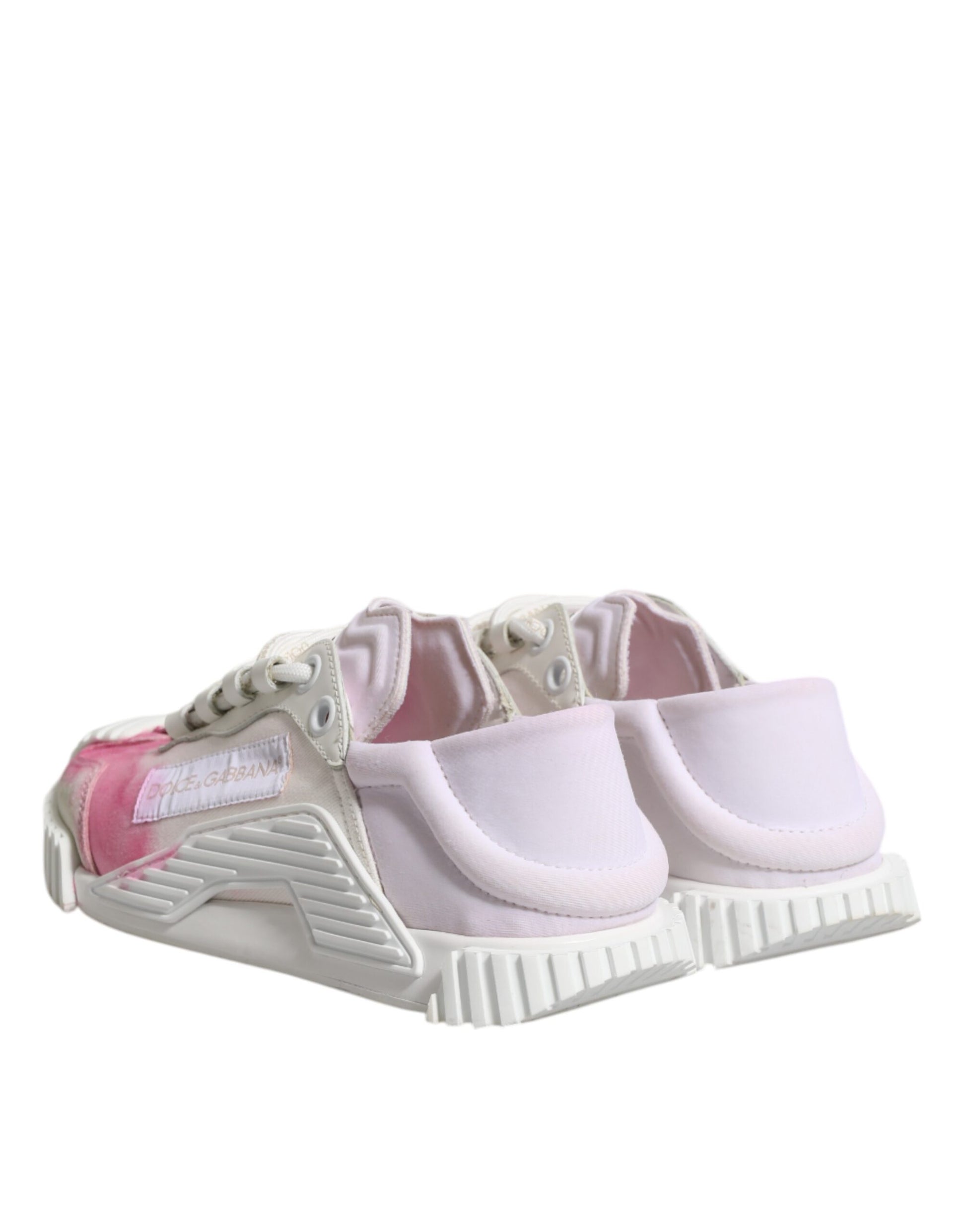 Pink and white lace-up sneakers with a low top, featuring a chunky sole design