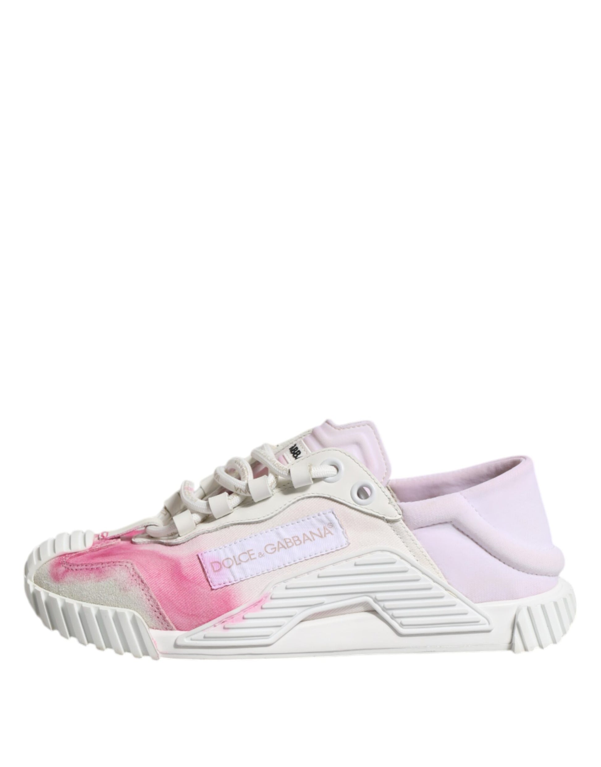 Pink and white lace-up sneakers with a stain on the side