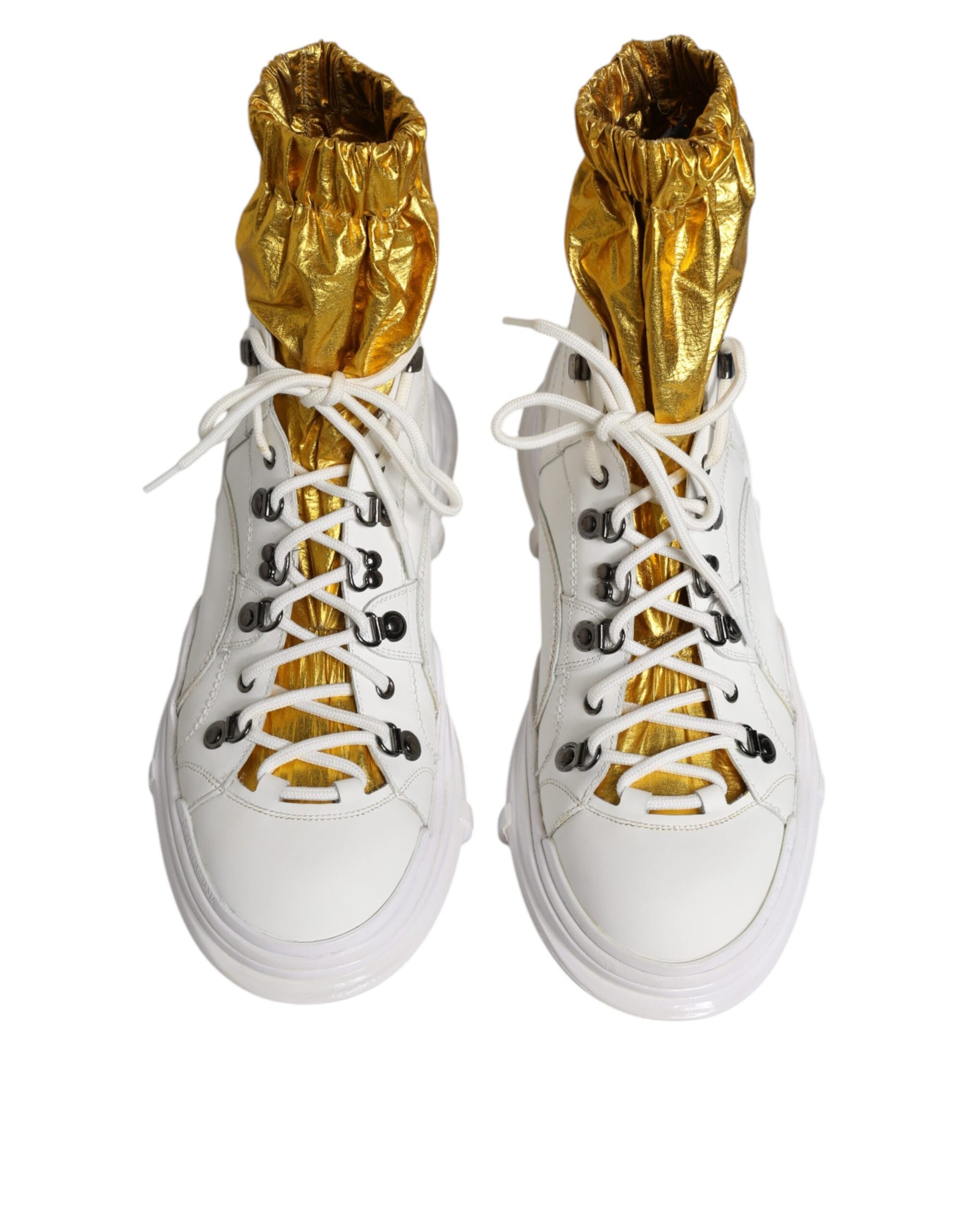 Pair of white nylon high top sneakers with gold accents and laces