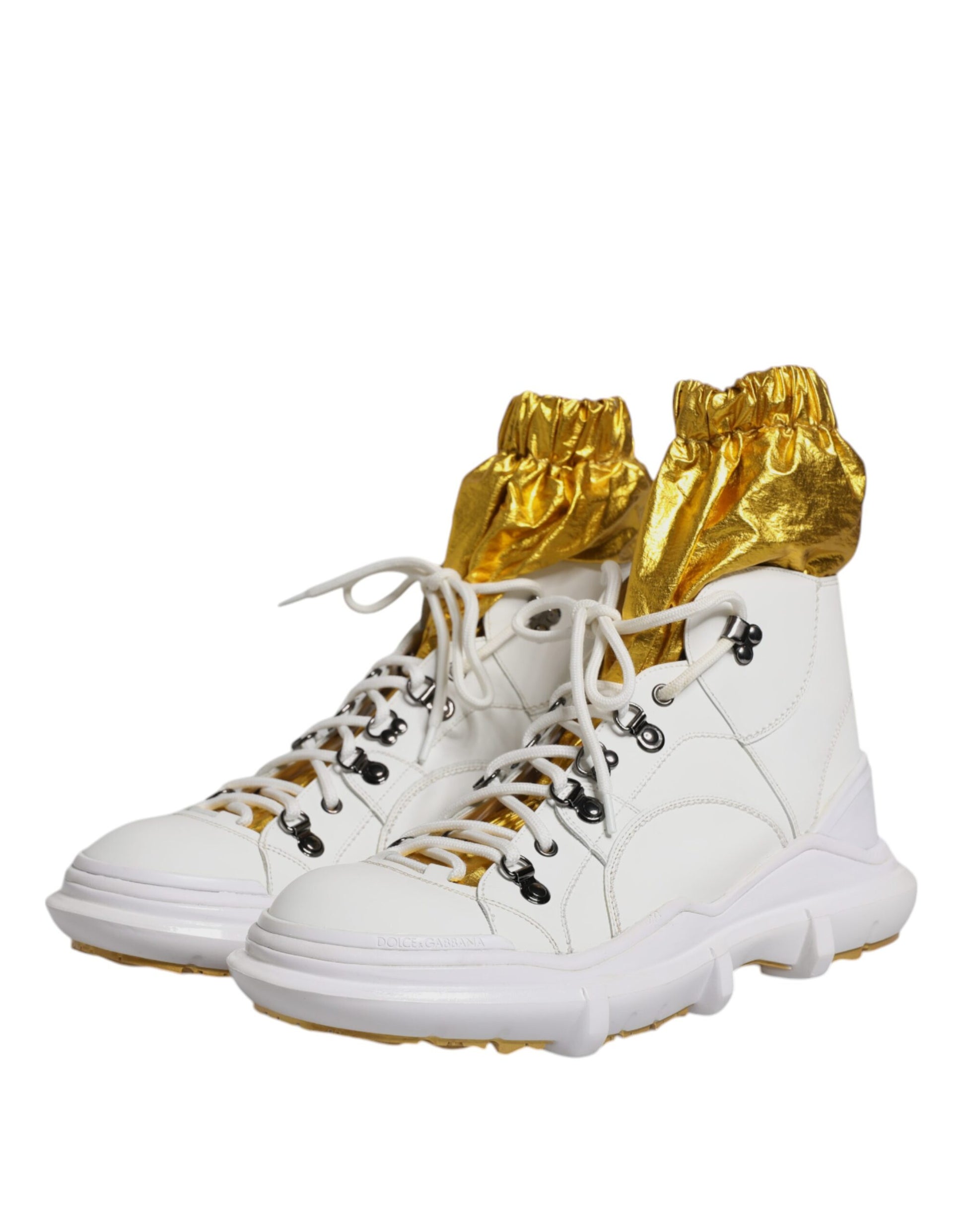 White nylon sneakers with gold laces and soles, featuring the D&G logo