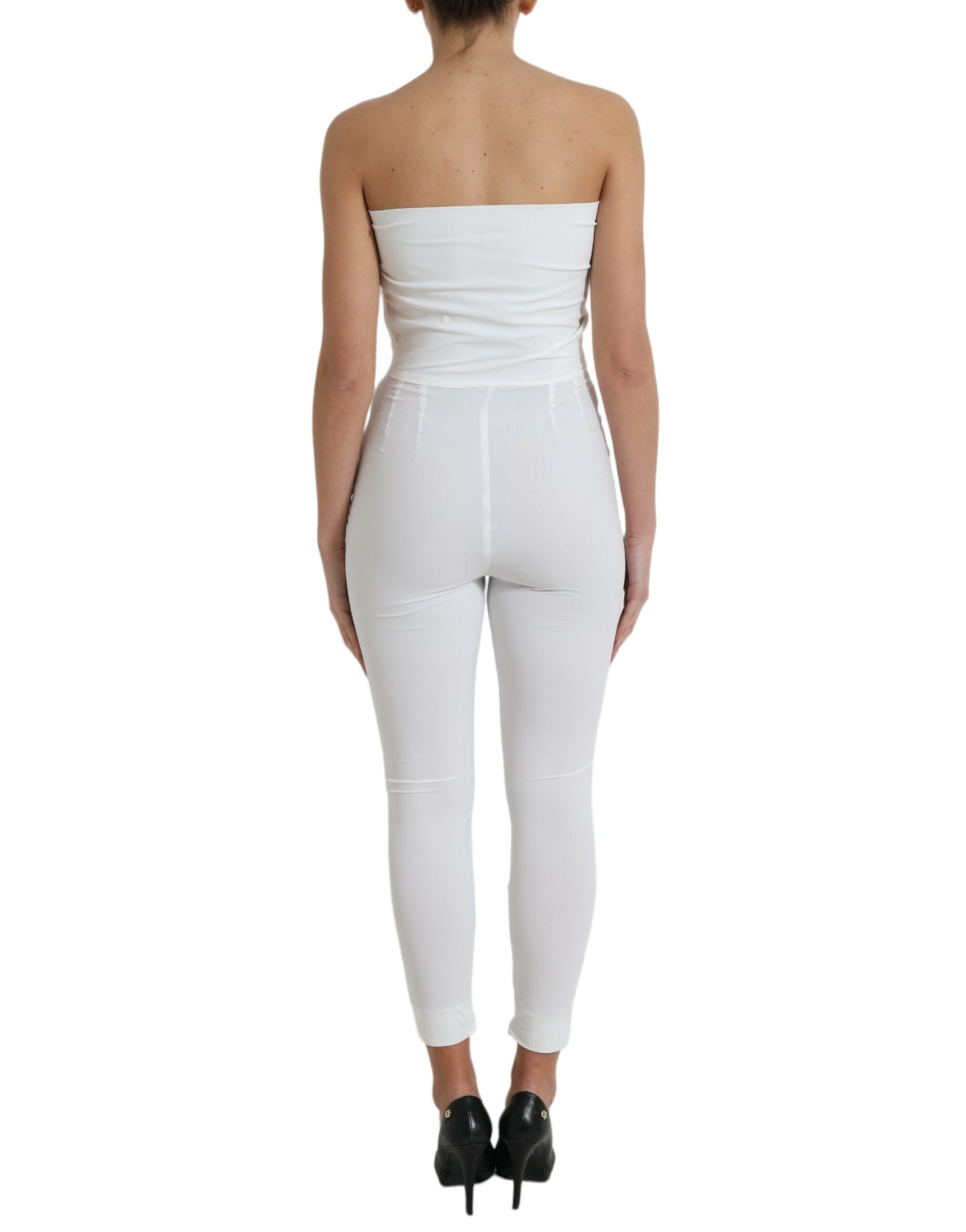 A white nylon strapless bodycon jumpsuit dress with a fitted silhouette