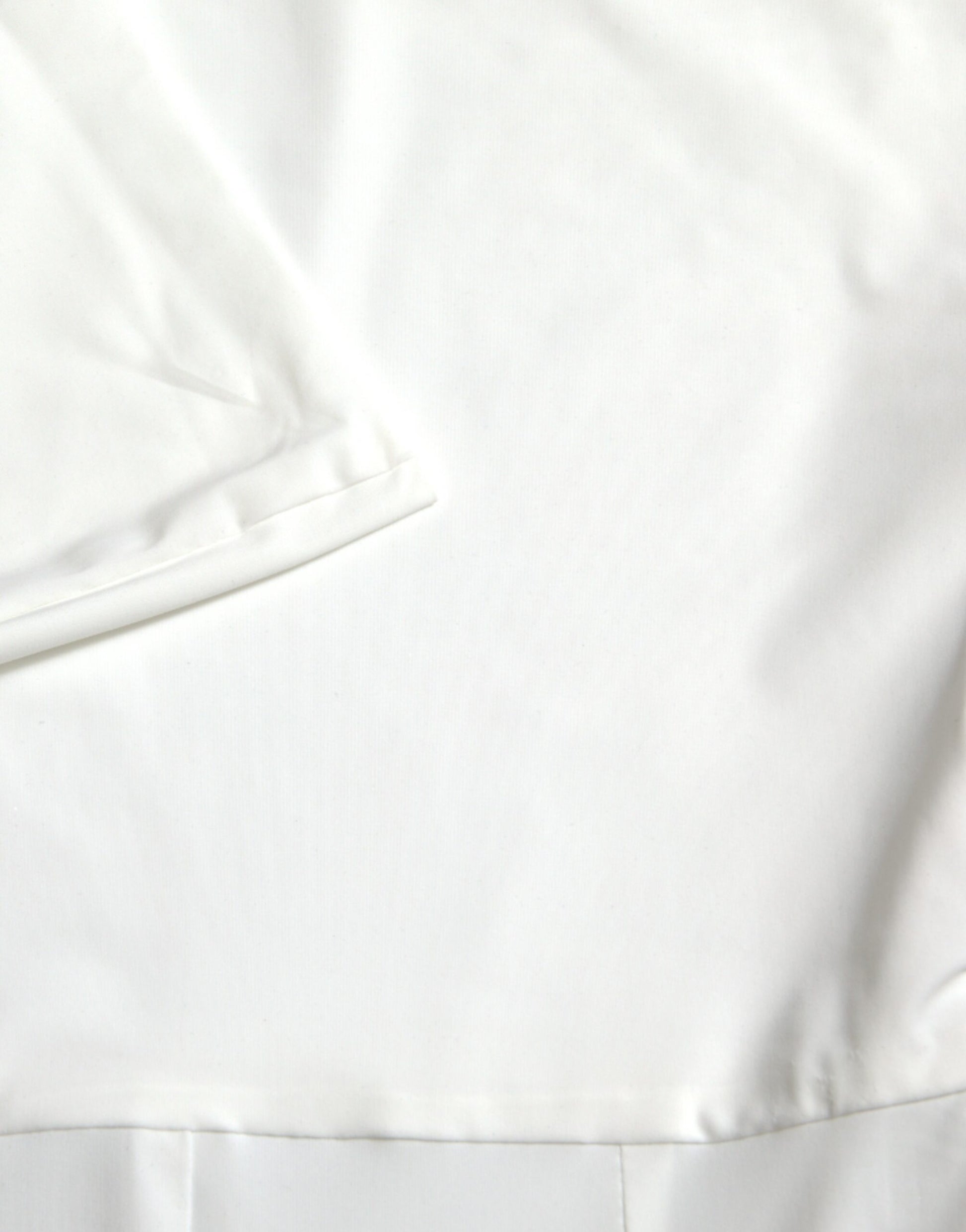 A white strapless bodycon jumpsuit dress with a nylon texture