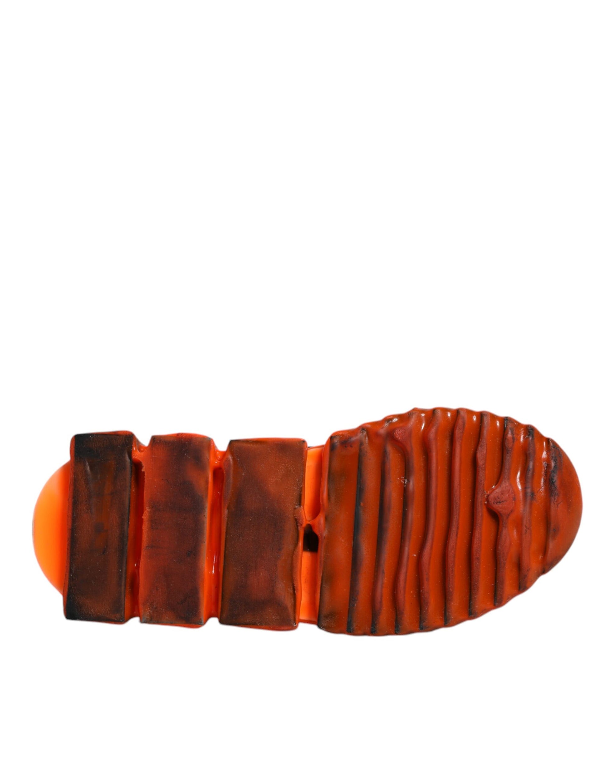 Red and white slip on shoes with orange sole