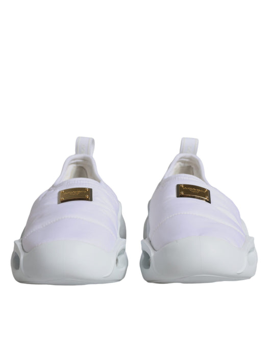 Pair of white sneakers with gold accents