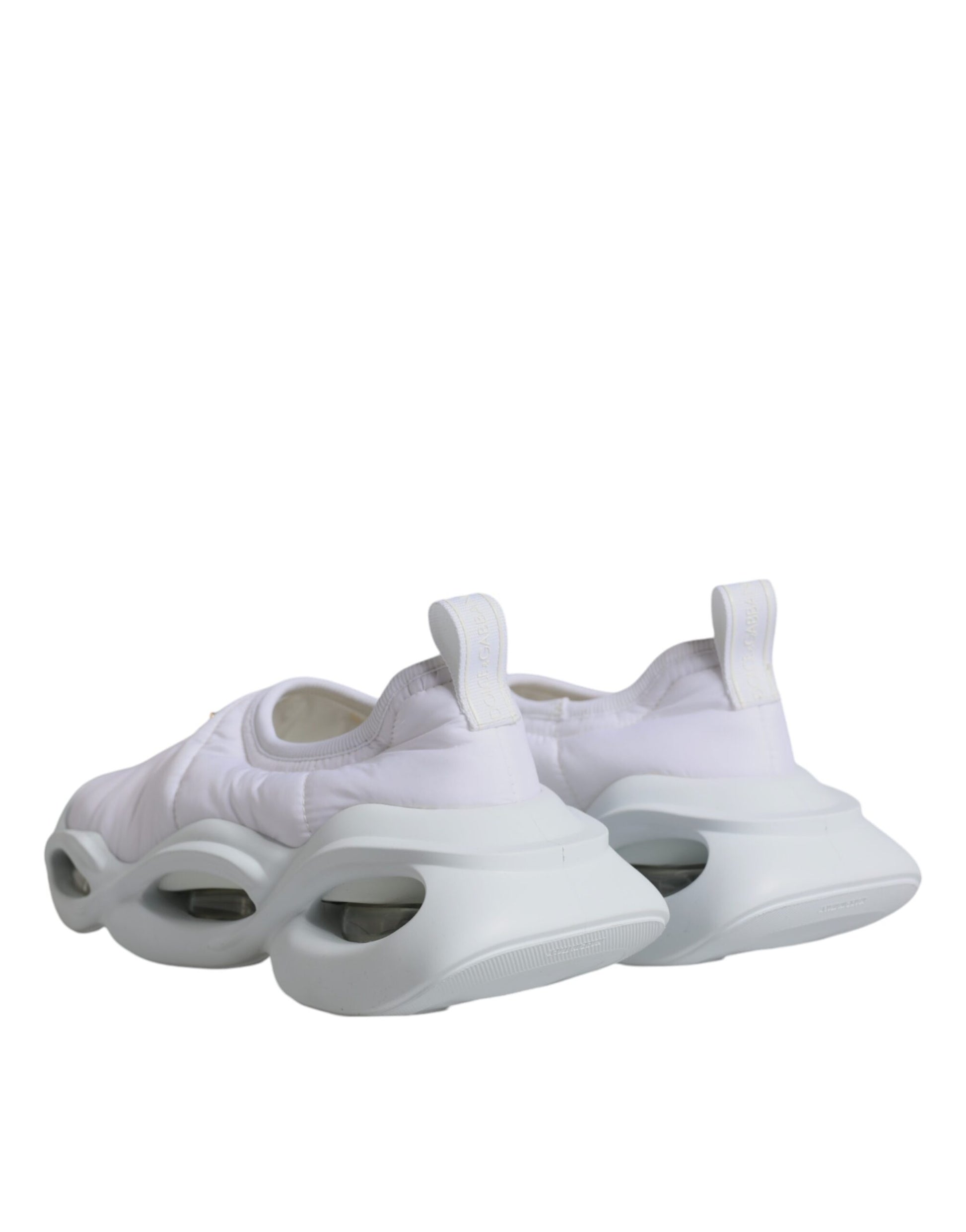Pair of white sneakers with pink accents and laces