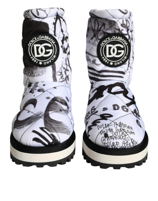 Pair of white boots with black writing on them