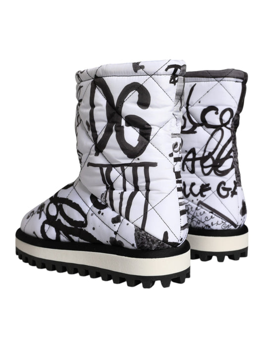 Pair of white boots with black writing