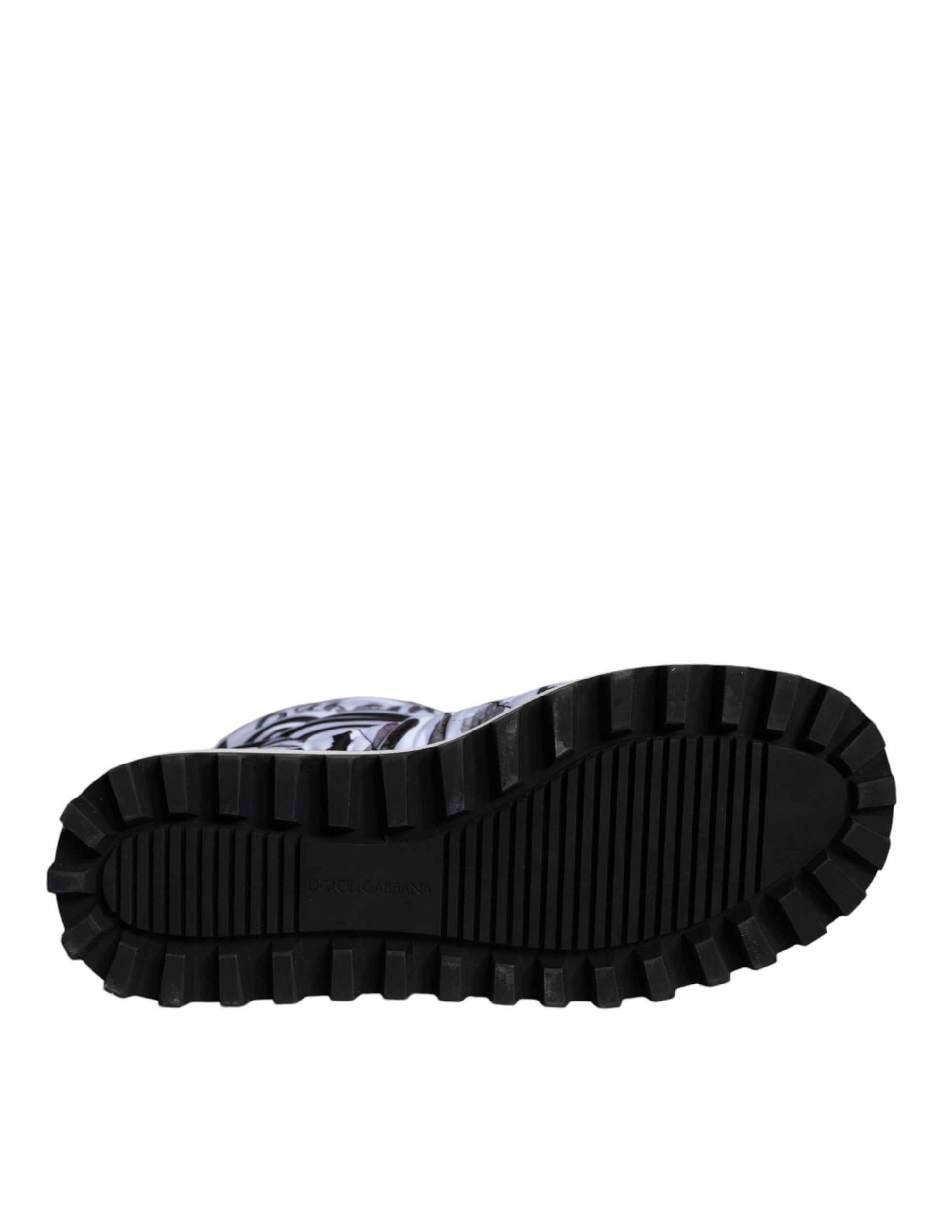 Black hiking boot with deep treads for outdoor use