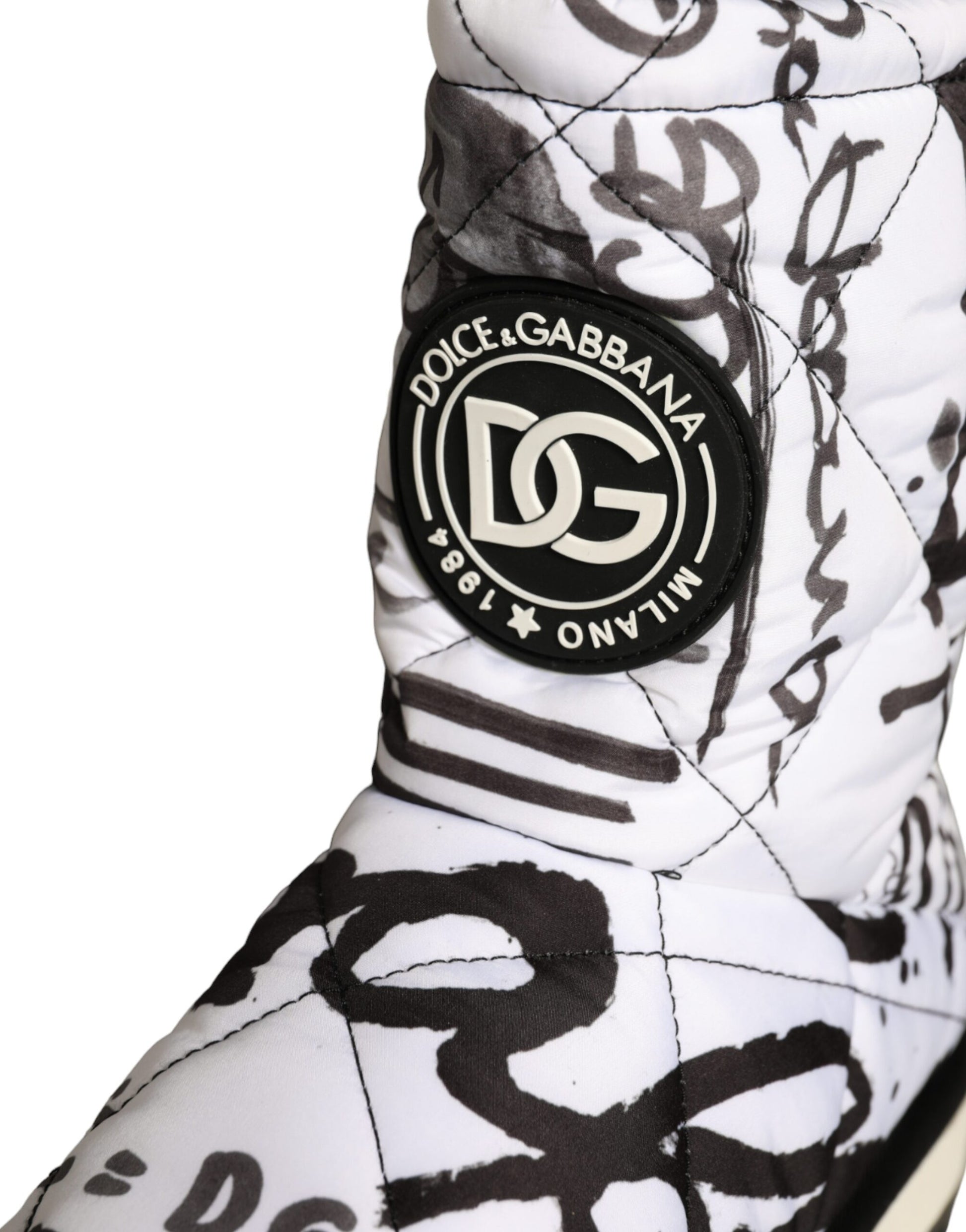 White boot with black logo on side