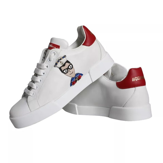 Pair of white sneakers with red accents and a graphic on the side