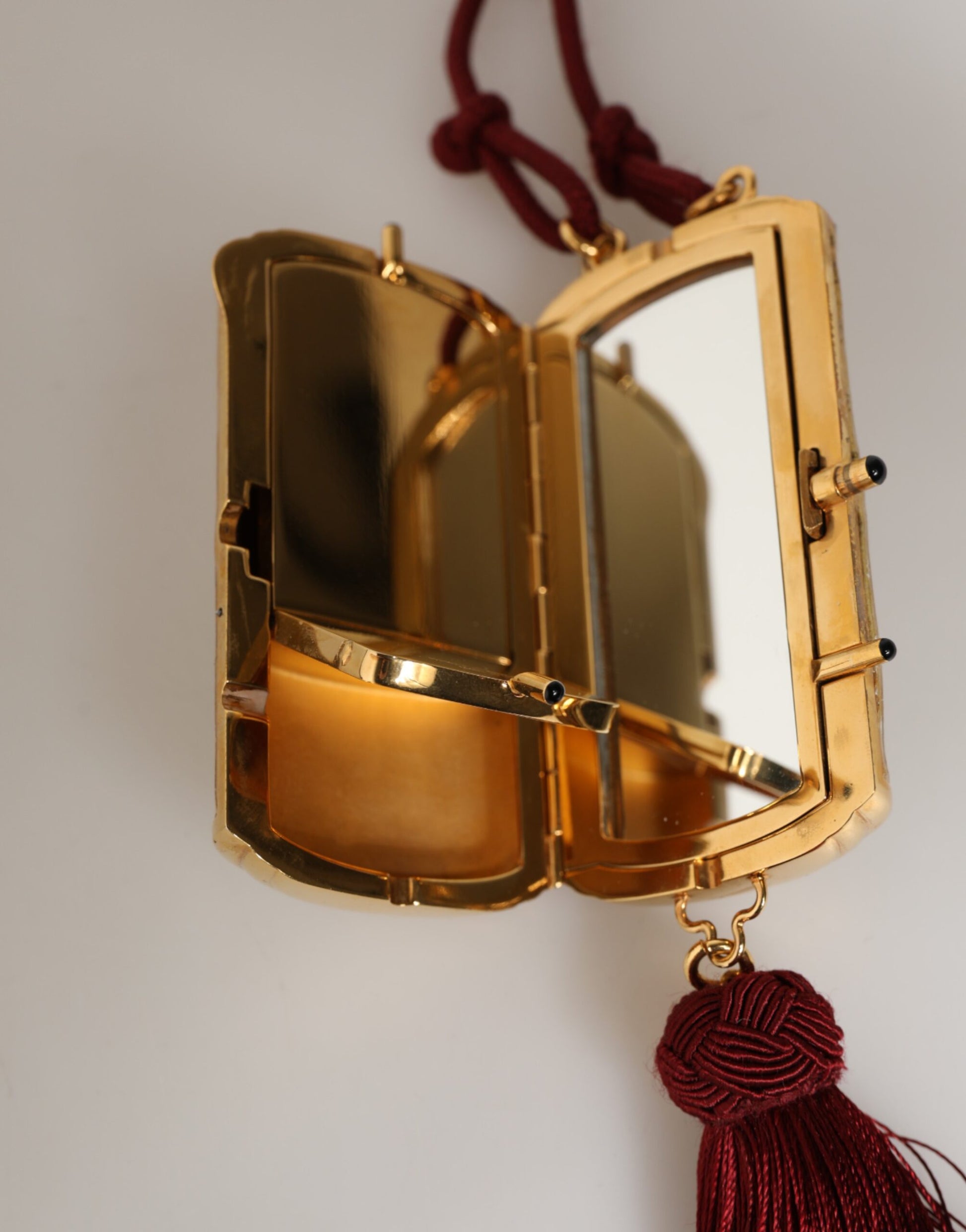 Gold pocket watch pendant on chain