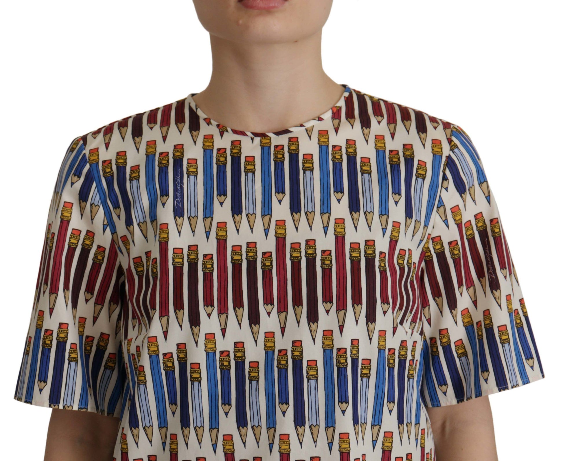 The shirt has a pattern of pencils on it