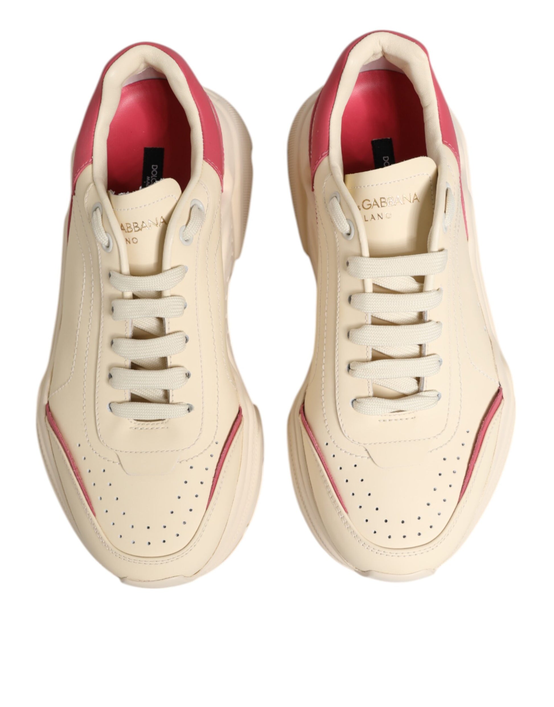Tan leather sneakers with red accents, laces and logo on side