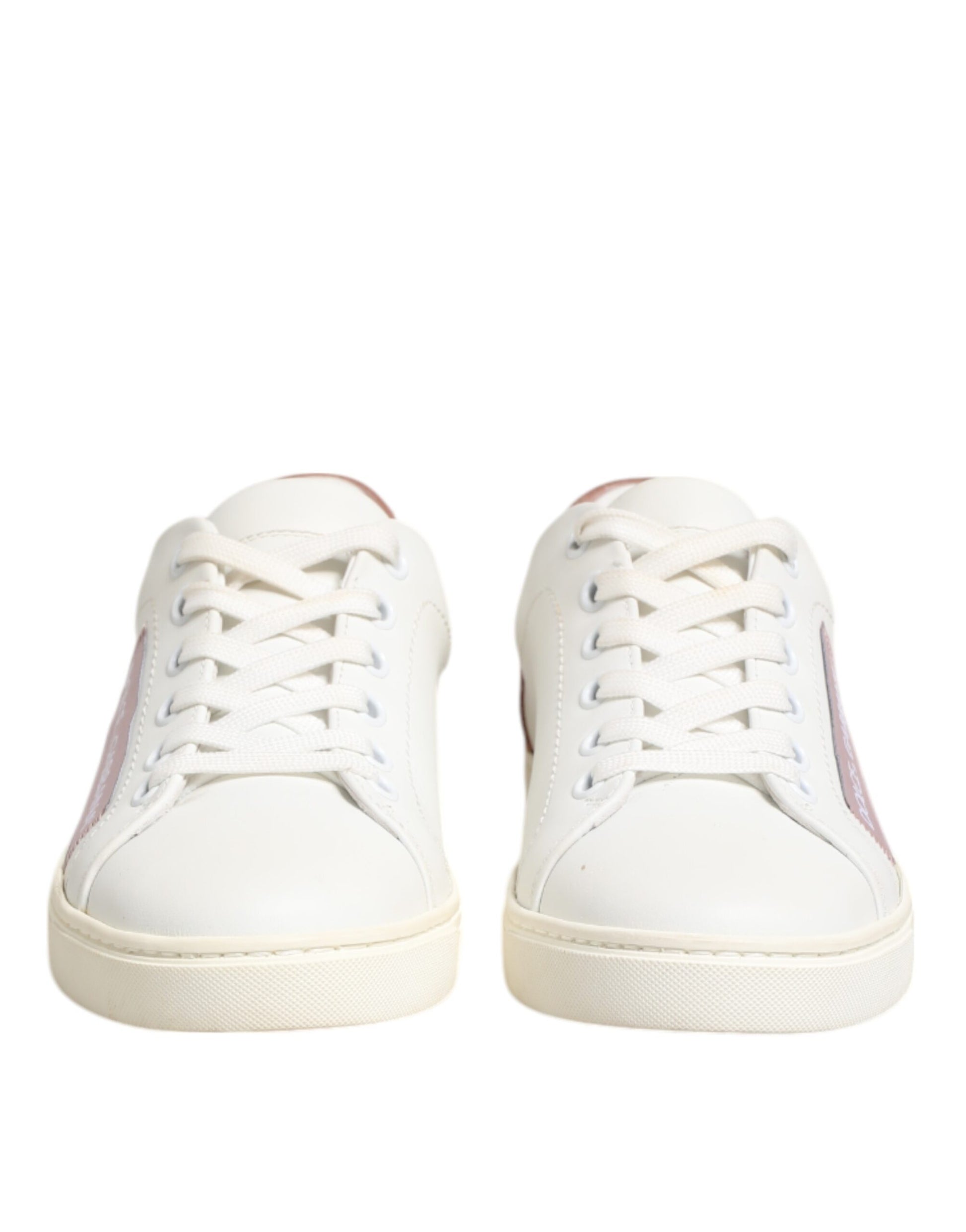 Pair of white sneakers with pink accents