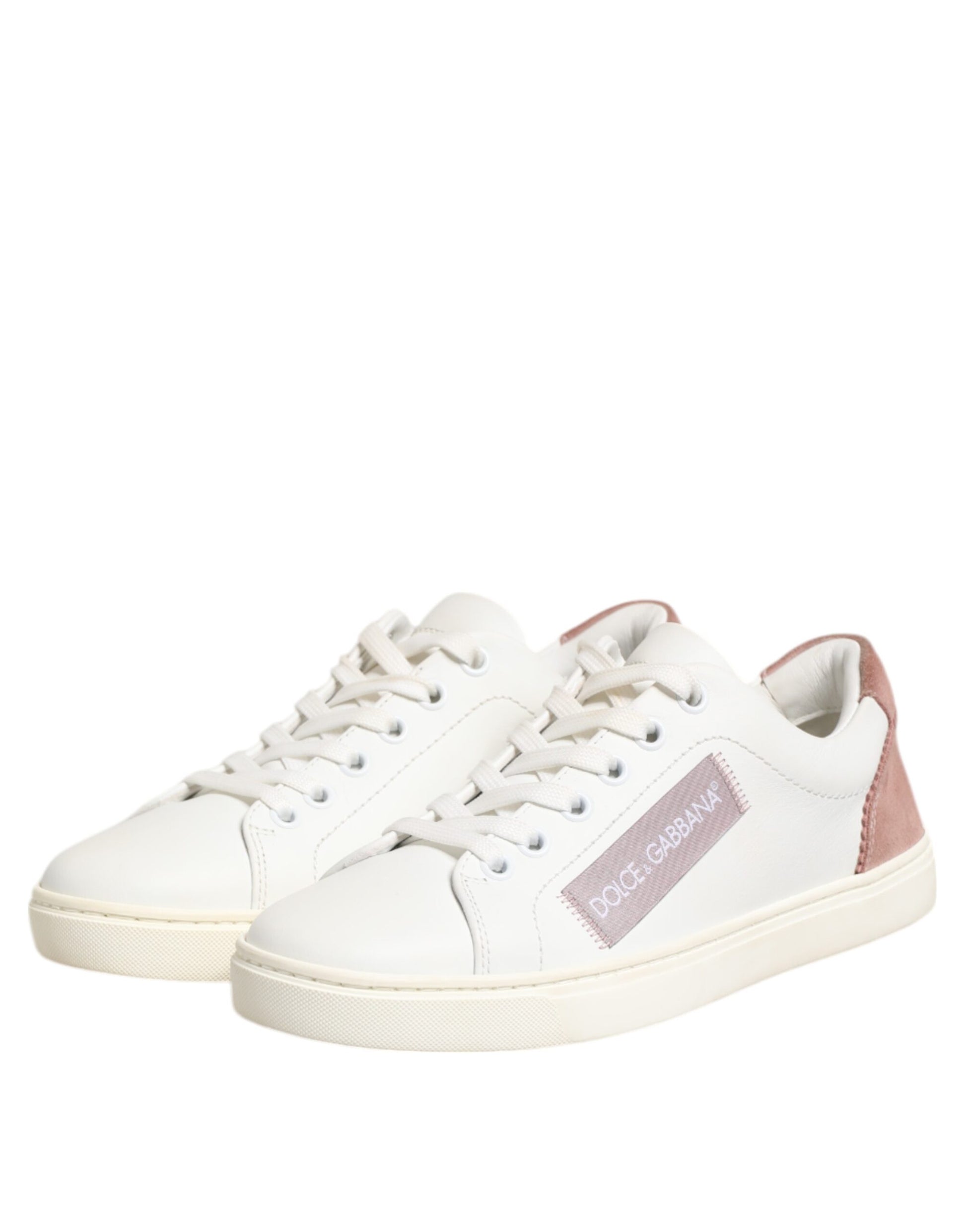 Pair of white sneakers with tan soles