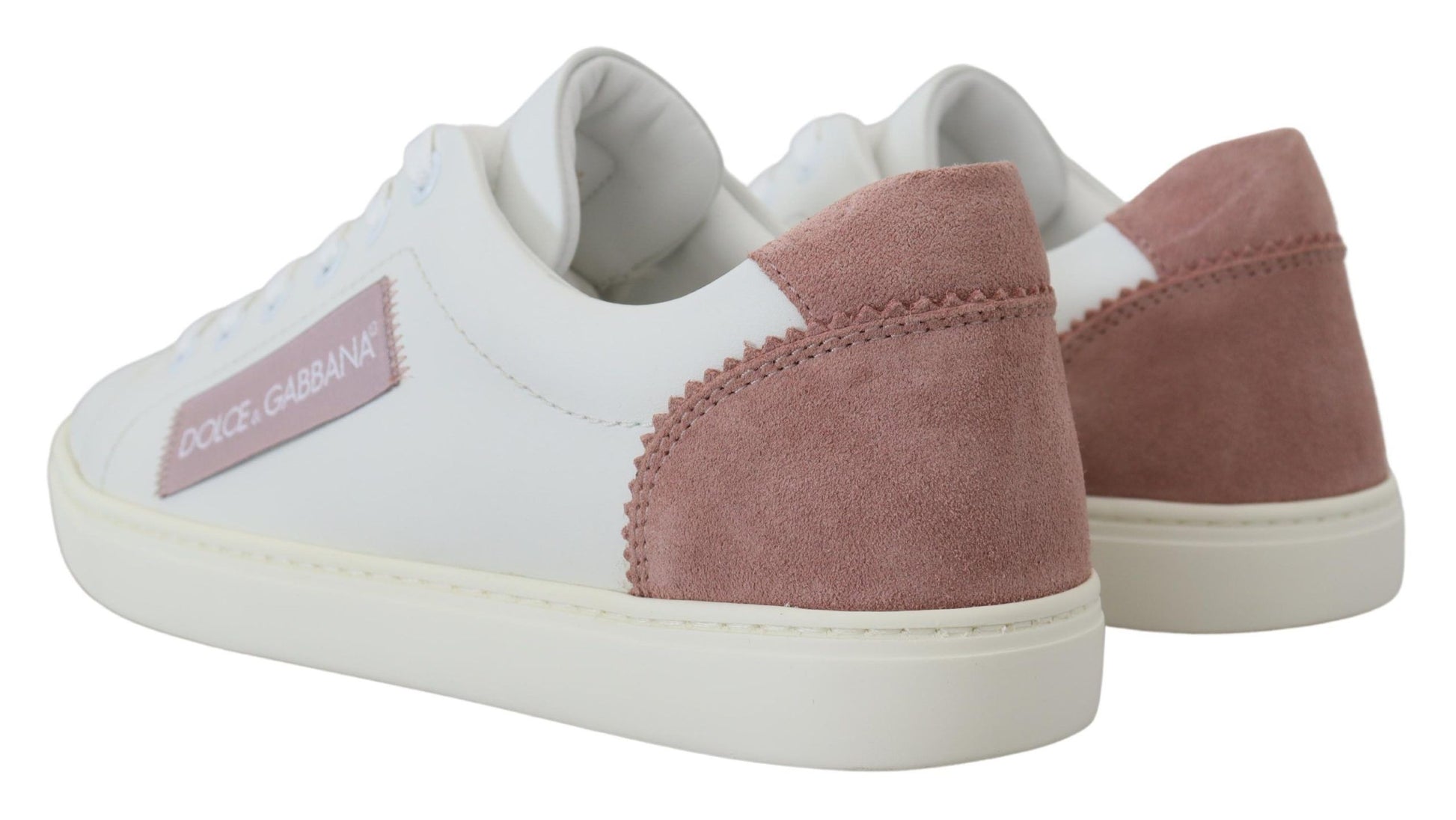 Pair of sneakers with pink and white soles
