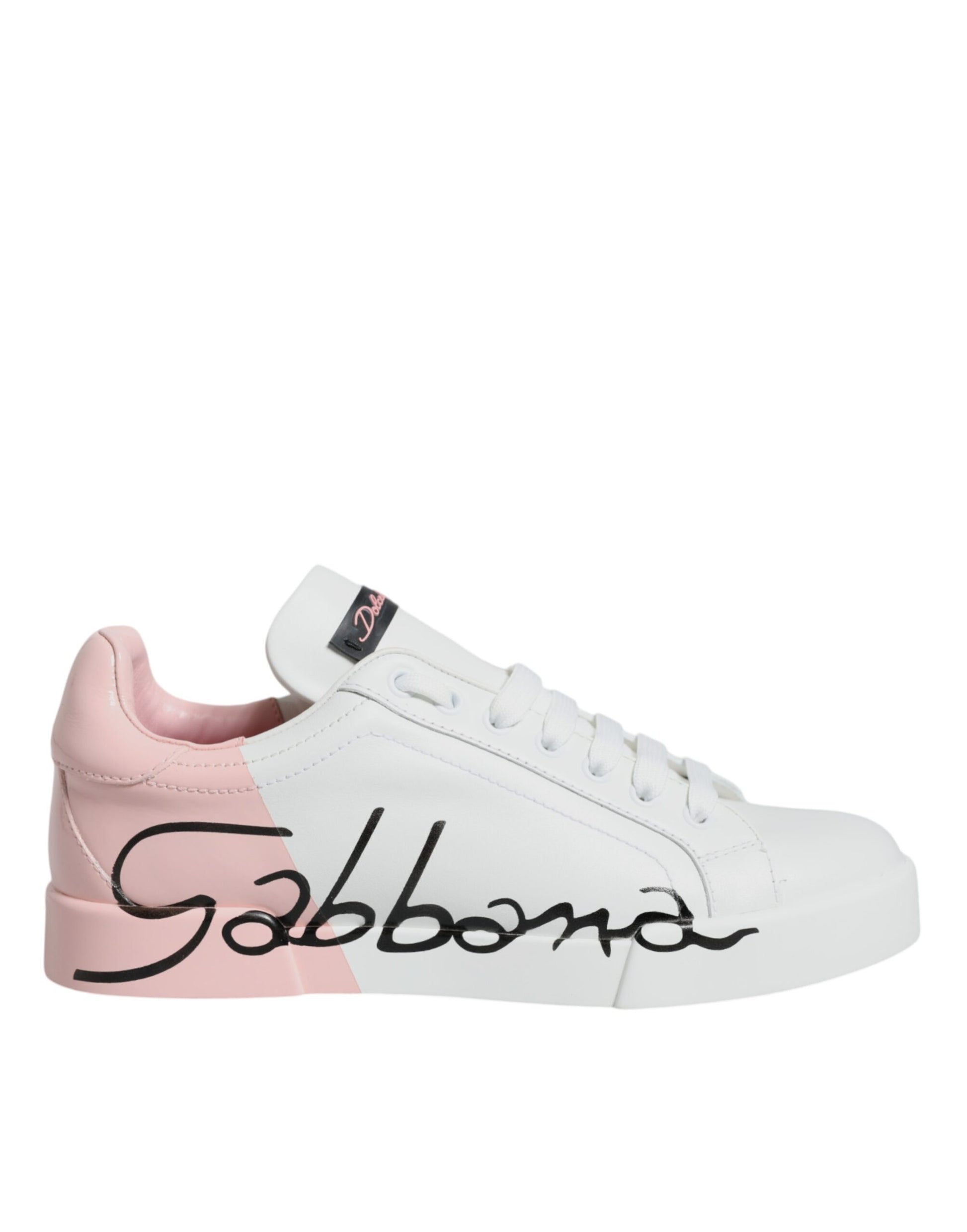 Pink and white sneakers with black laces