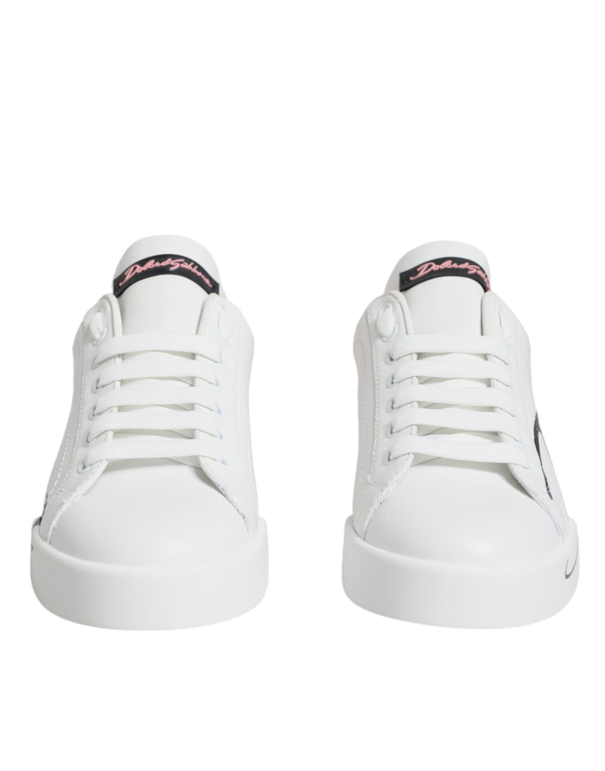 Pair of white sneakers with pink laces and a black logo on the side
