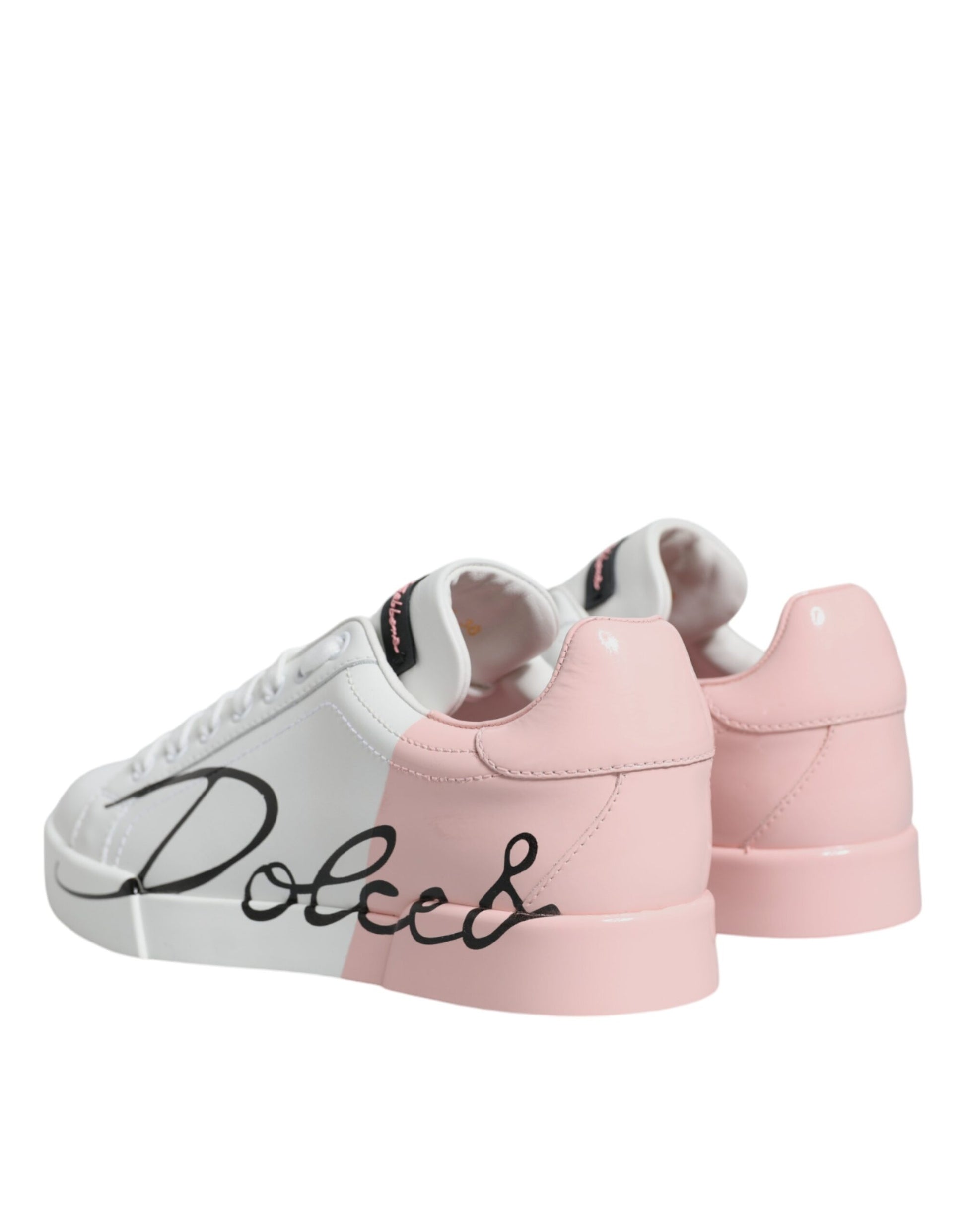 Pair of pink and white sneakers with black laces