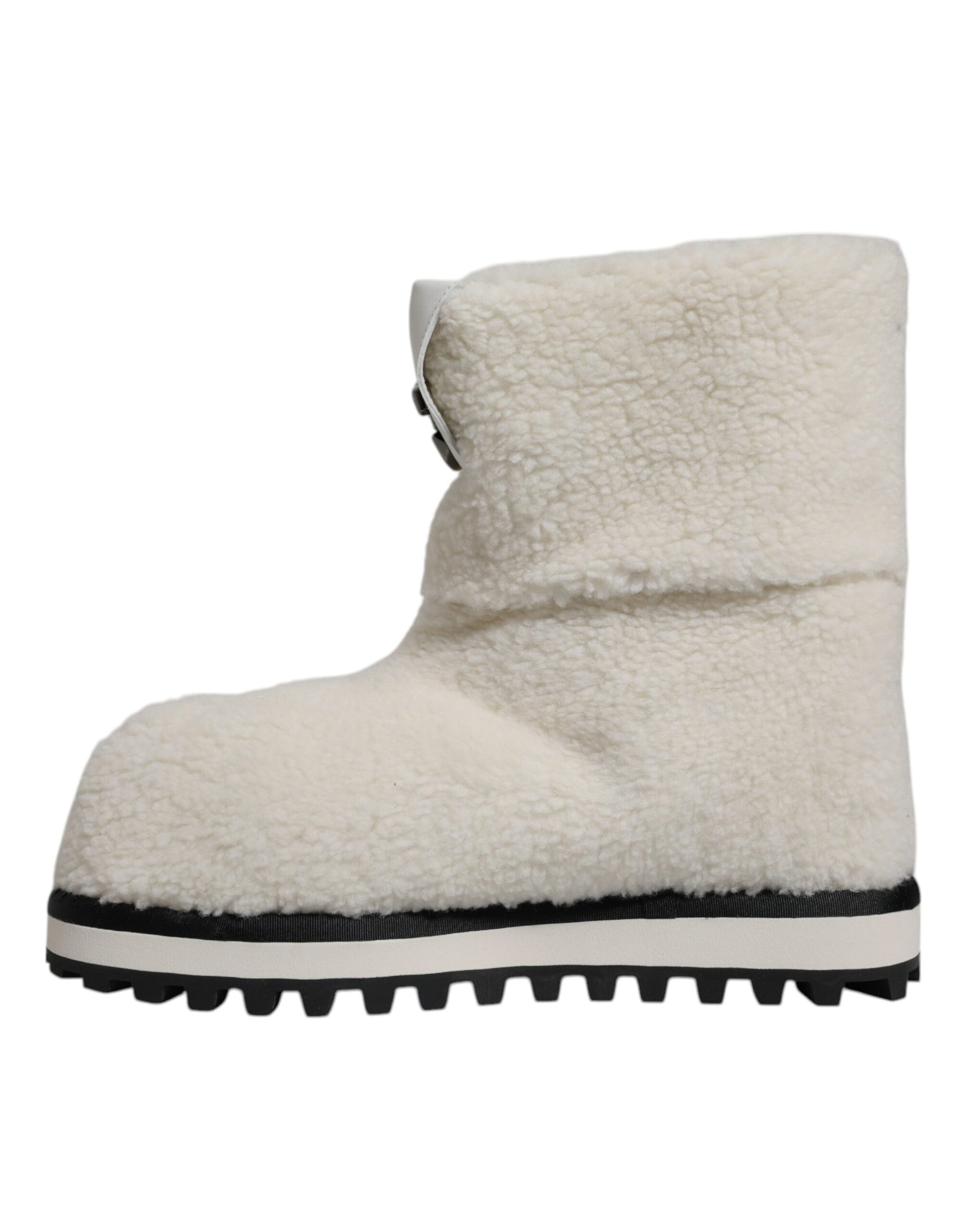Tan suede boot with black trim and sole