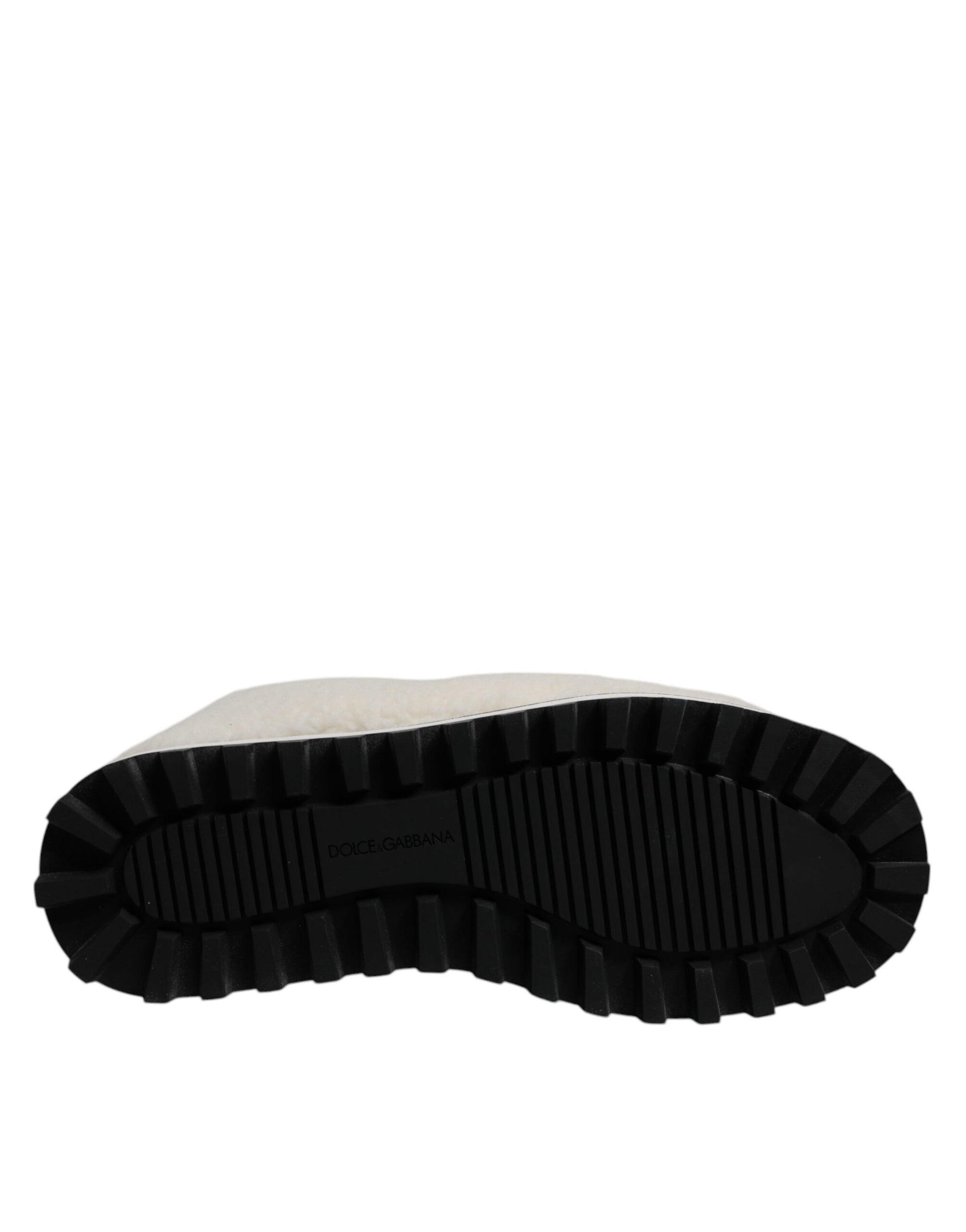 Black rubber boot with deep treads