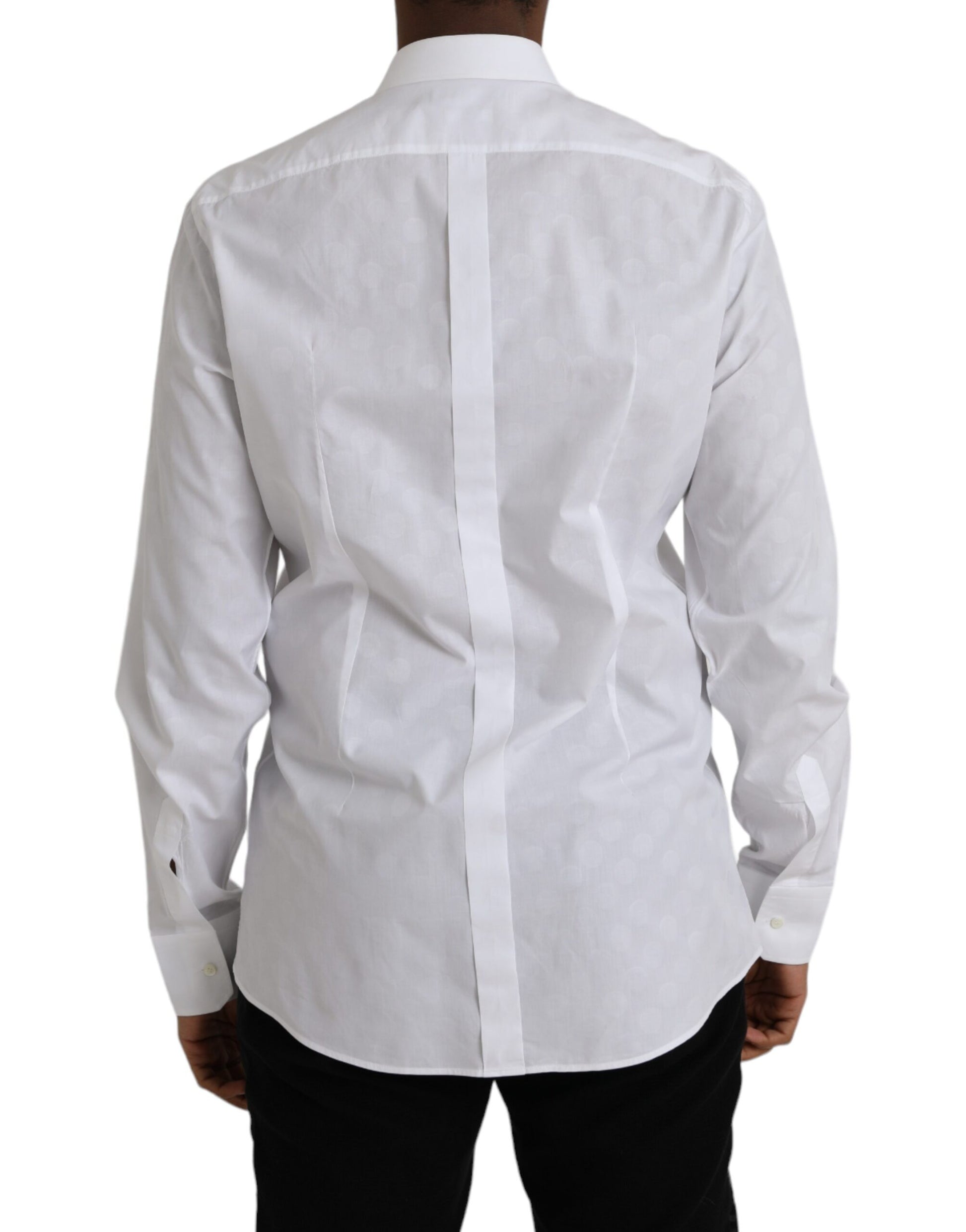 A white polka dotted cotton dress shirt with a gold collar and cuffs