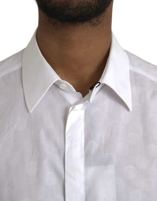 A white polka dotted cotton dress shirt with a gold collar and cuffs