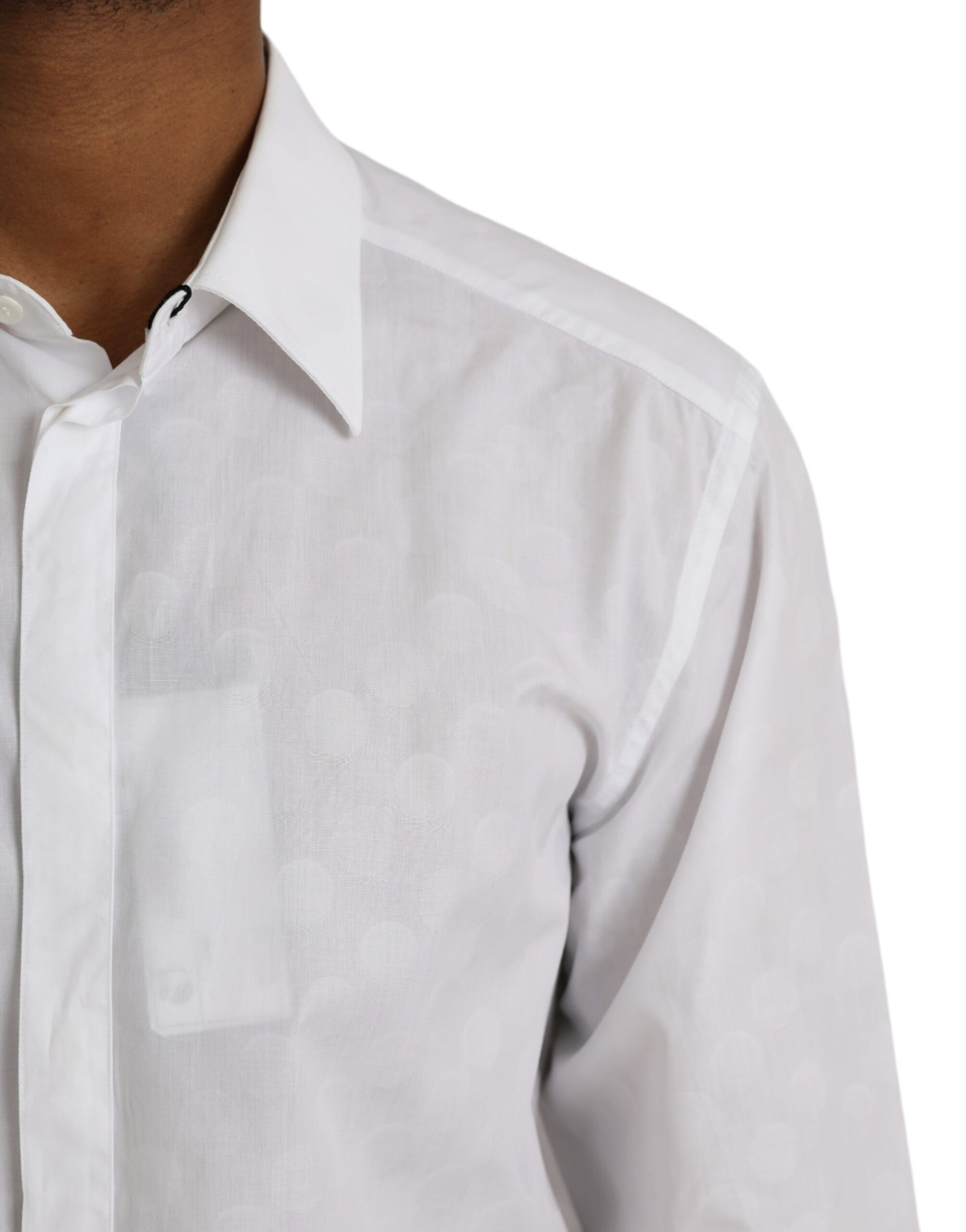 A white polka dotted cotton dress shirt with a gold collar and cuffs