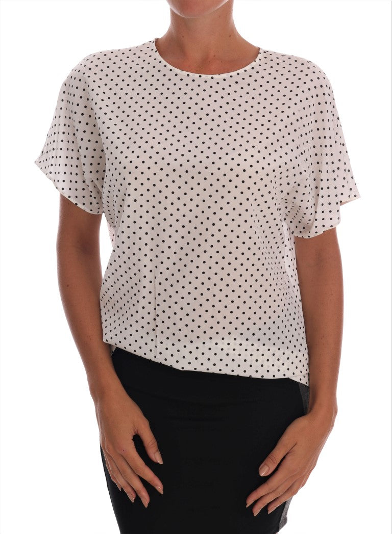 White polka dot blouse on woman