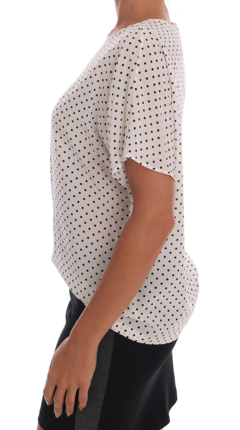 White polka dot blouse on woman