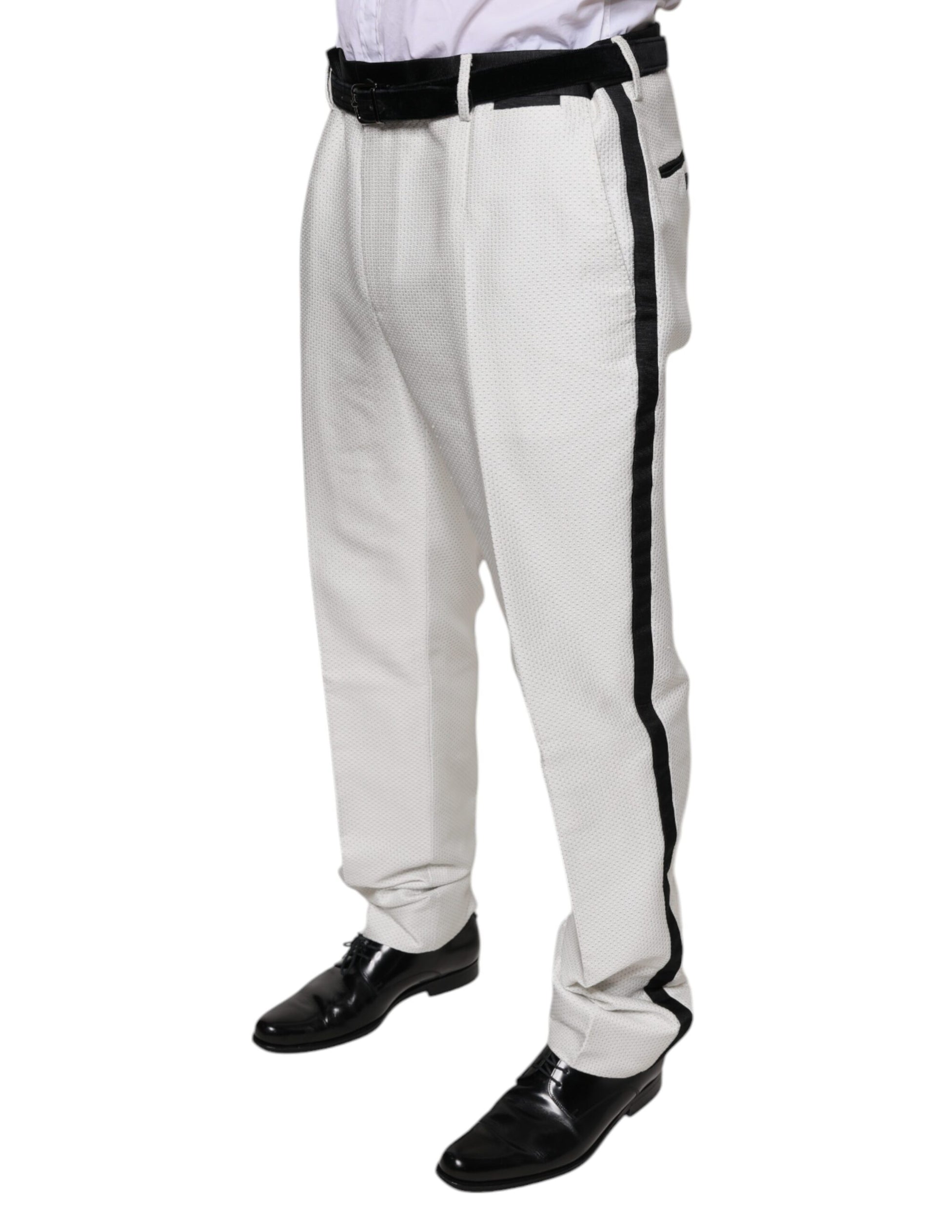 A pair of white polyester formal dress pants with black stripes down the sides, designed by Dolce & Gabbana