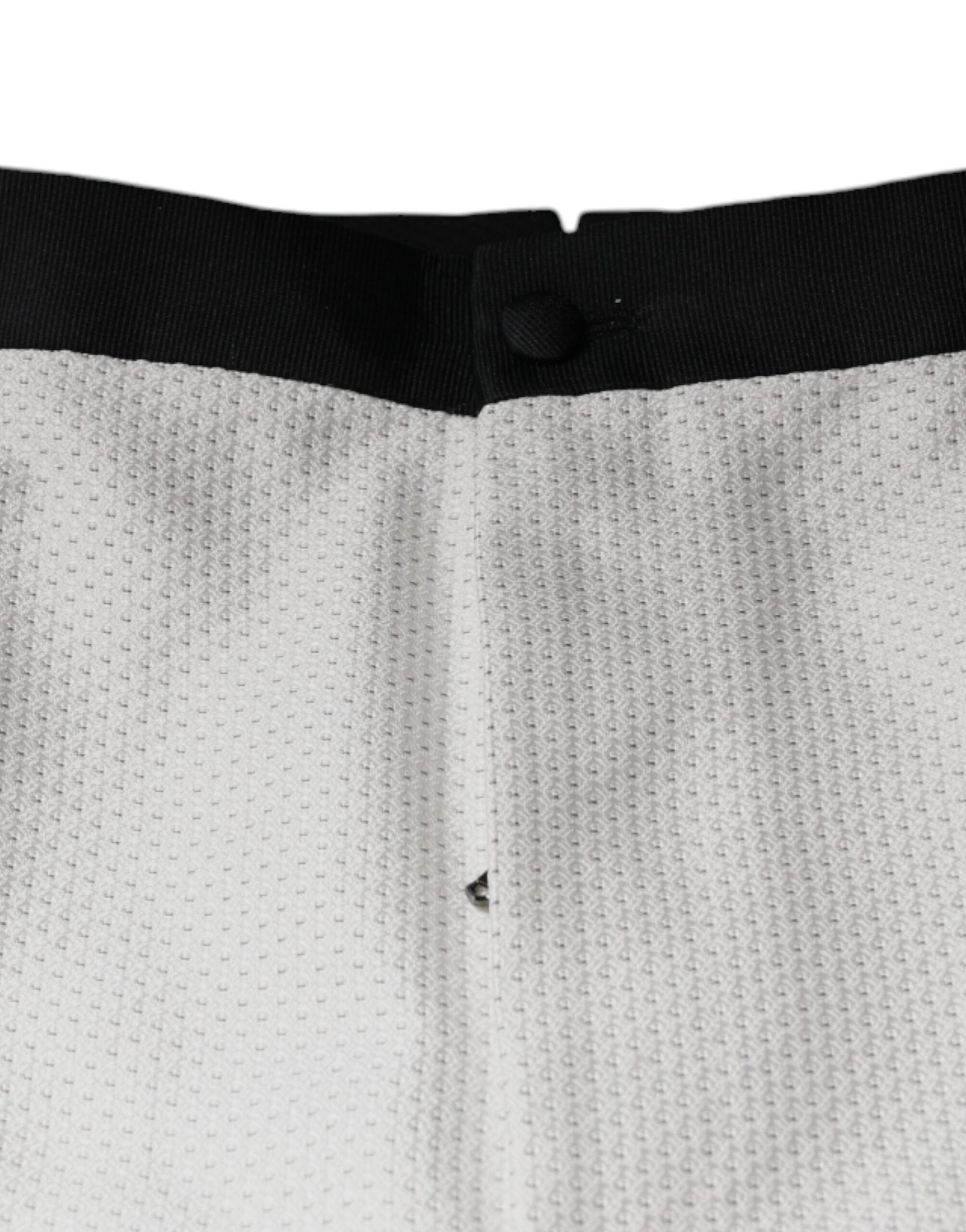 White polyester formal dress pants with black trim, featuring a textured pattern and a small hole on the left leg